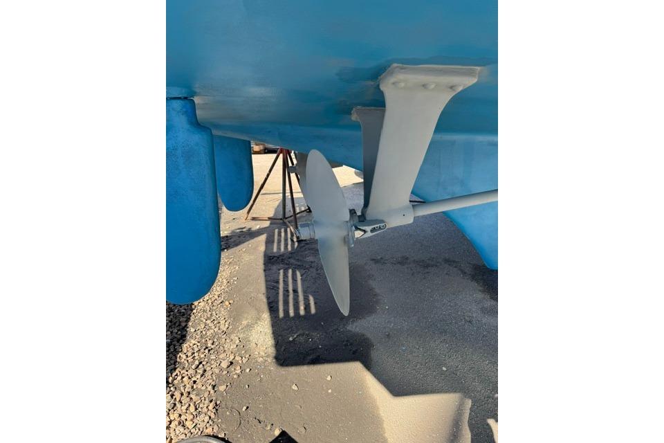 Propeller and rudder of 1983 Grand Banks 42 Motoryacht on dry dock.