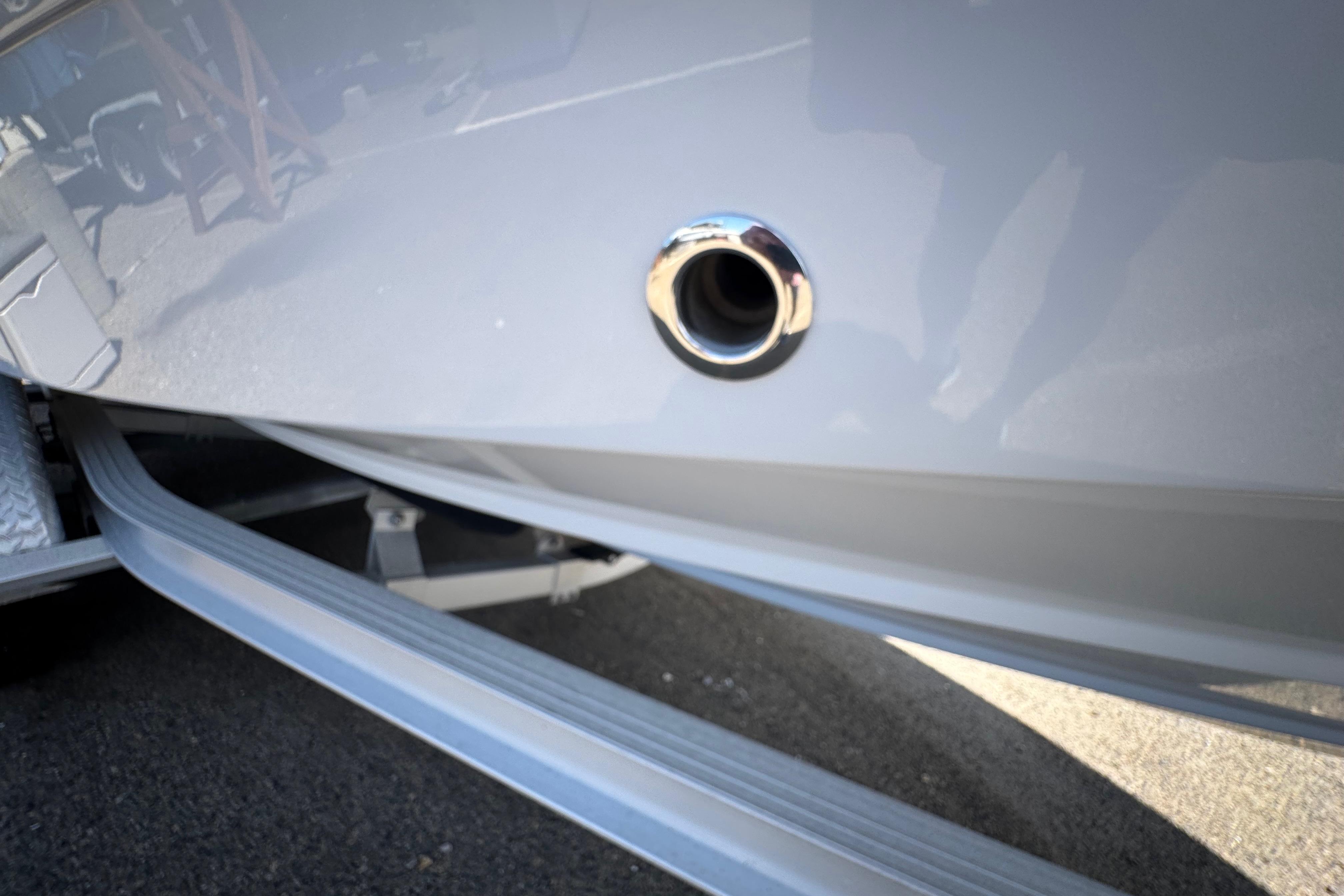 2022 Robalo R230 Center Console boat detail, featuring a chrome drain outlet.
