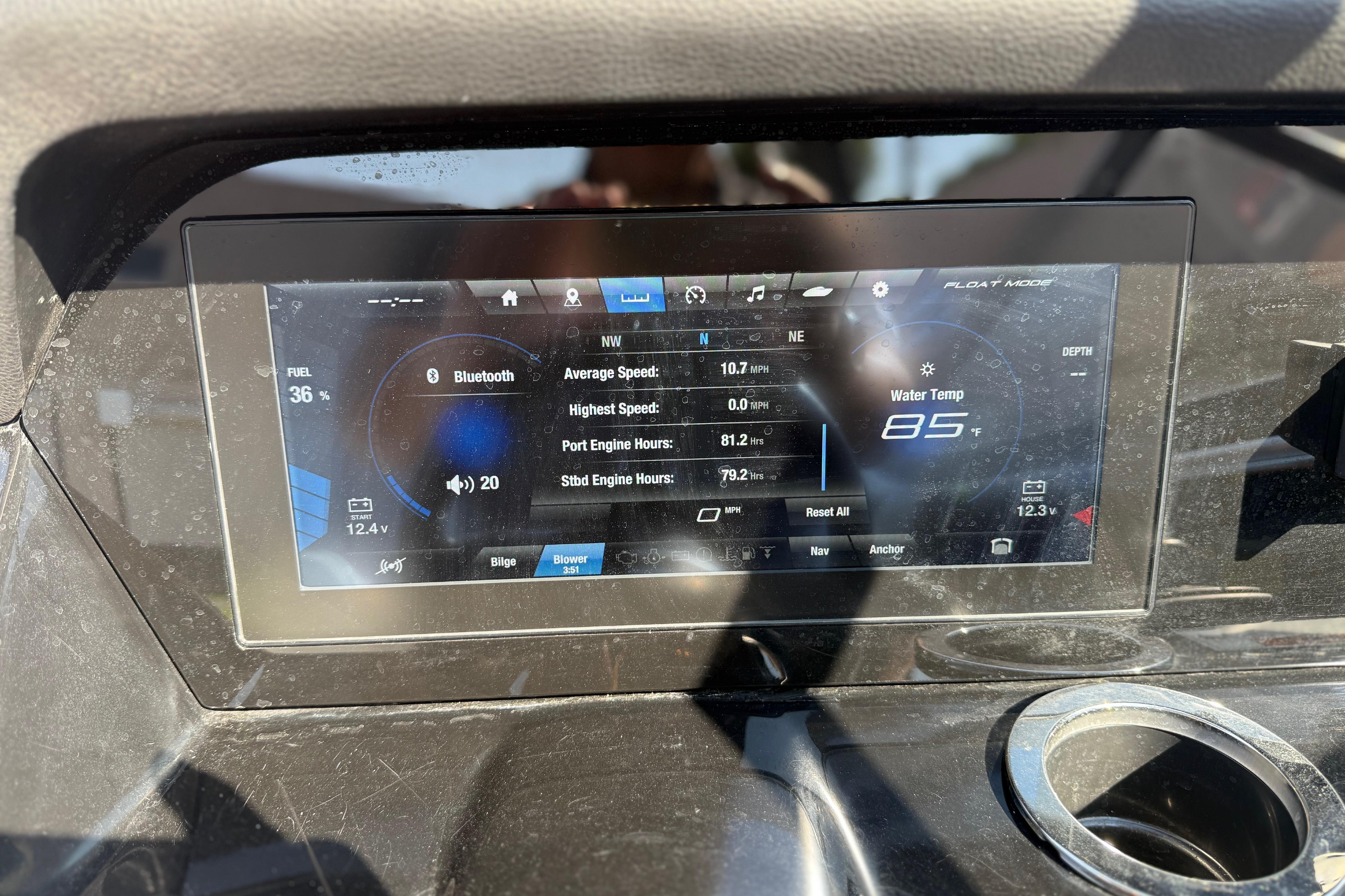 Dashboard display of a 2022 Yamaha Boats 212XE showing speed, engine hours, and water temperature.