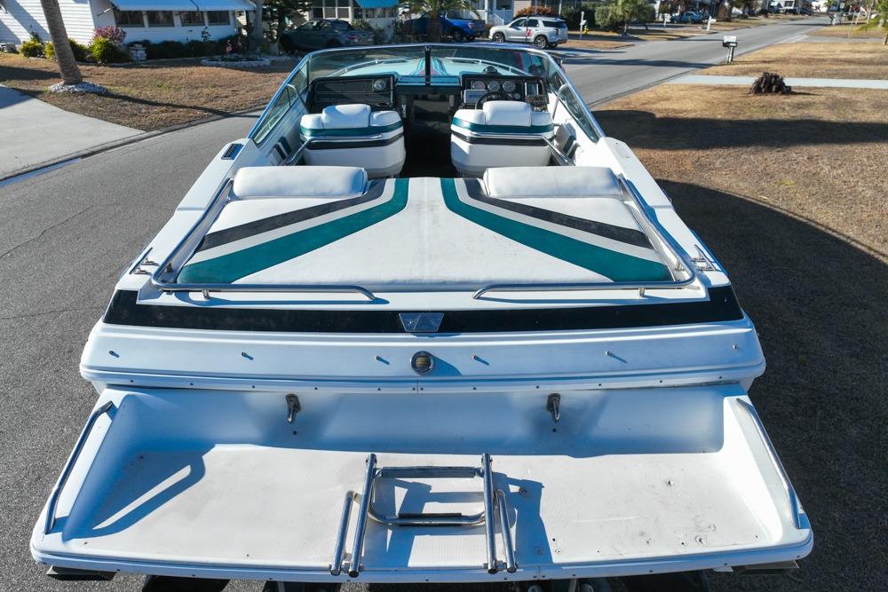 1989 Formula 292 SR-1 boat, rear view, parked on a residential street.