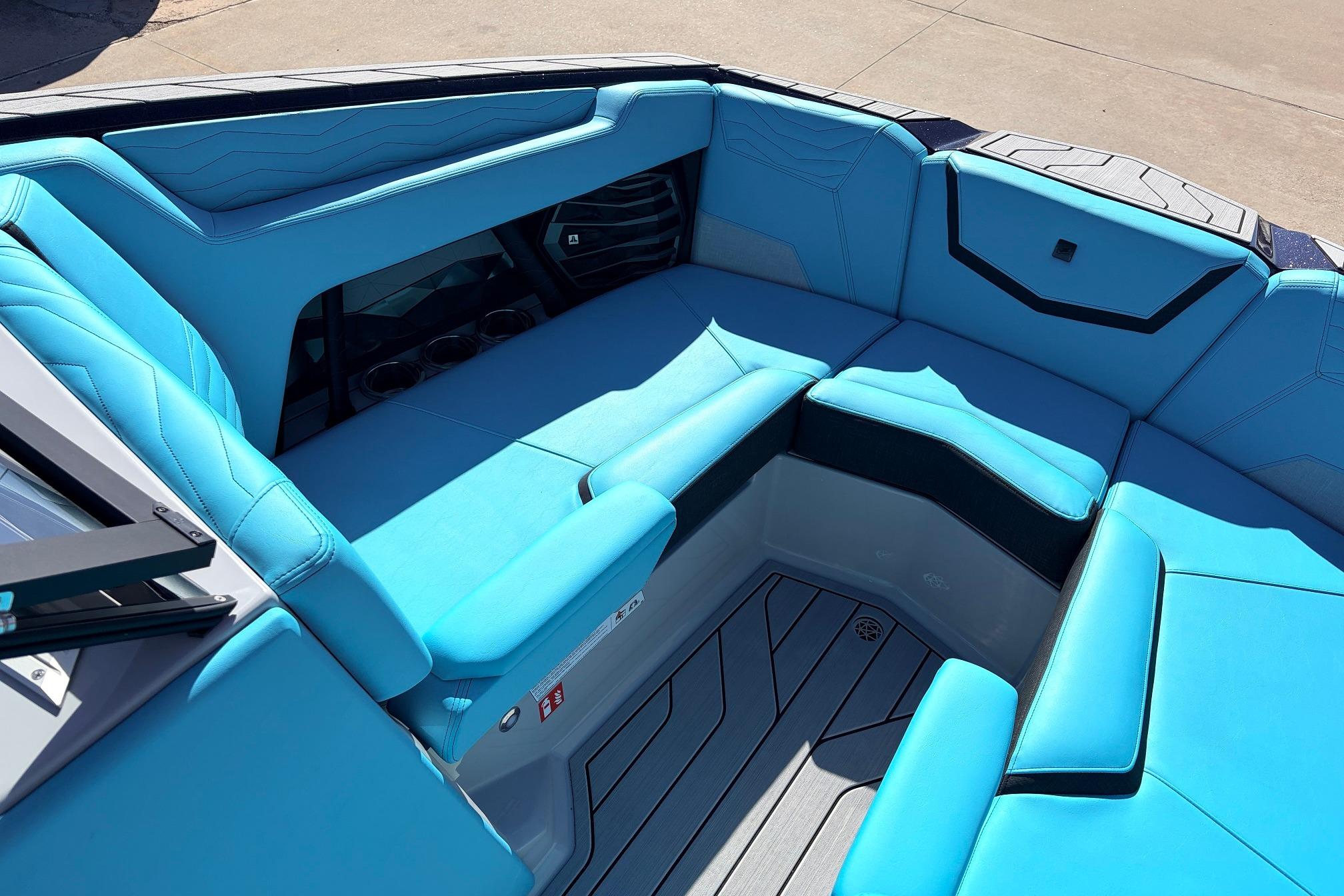 2026 Nautique Super Air Nautique G23 boat interior with blue seating and modern design.