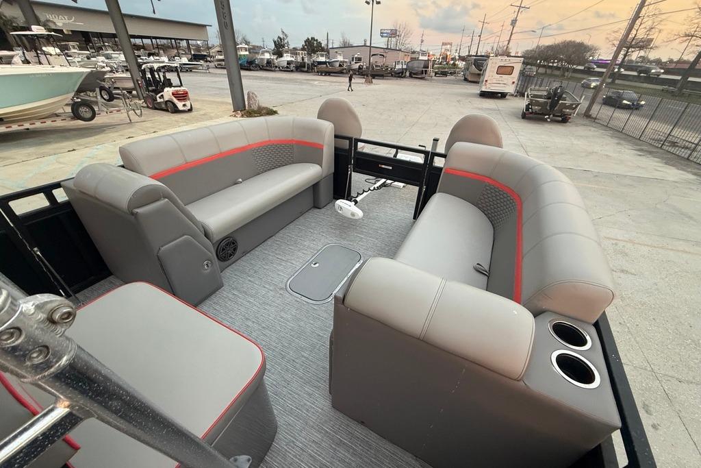 2022 Apex Marine 8524 Pro Fish N Cruise pontoon boat interior with gray seating and cup holders.