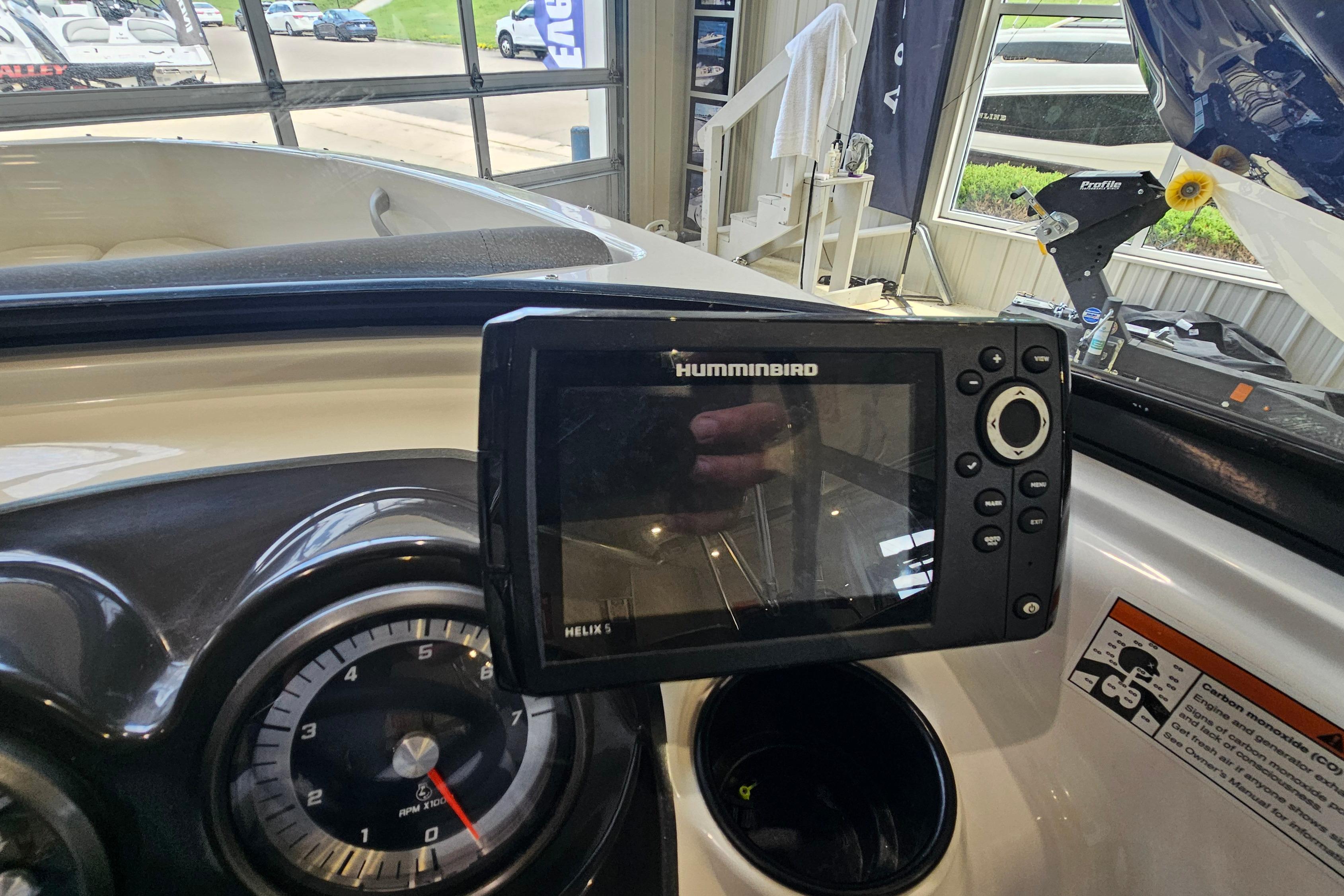 Humminbird Helix 5 fishfinder on 2019 Bayliner 170 Bowrider dashboard, indoor showroom.