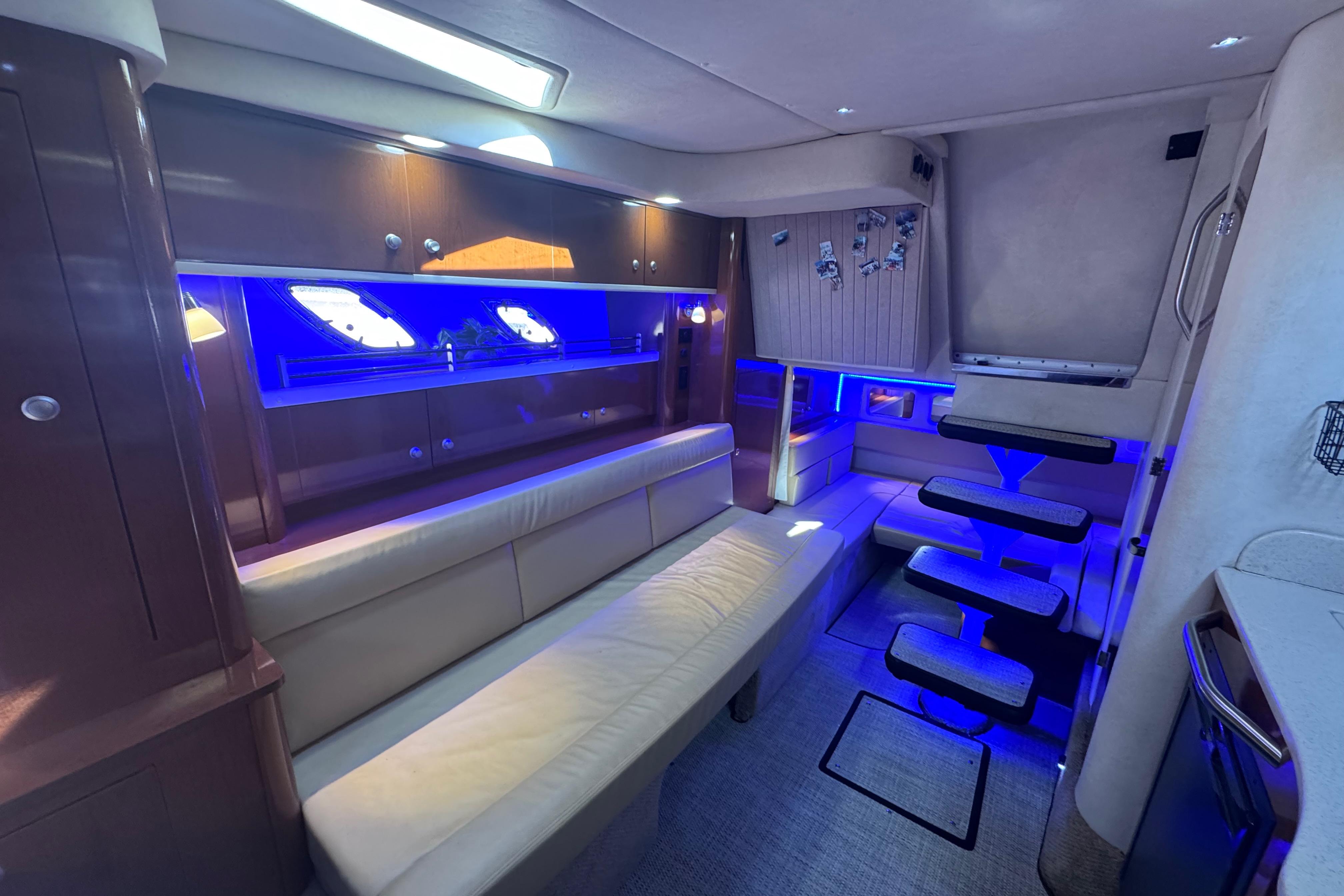 Luxurious interior of 2008 Sea Ray 350 Sundancer yacht with modern lighting and seating.