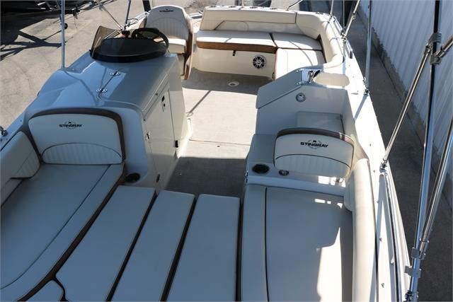 The image shows the interior of a 2022 Stingray 212 SC boat with white seating.