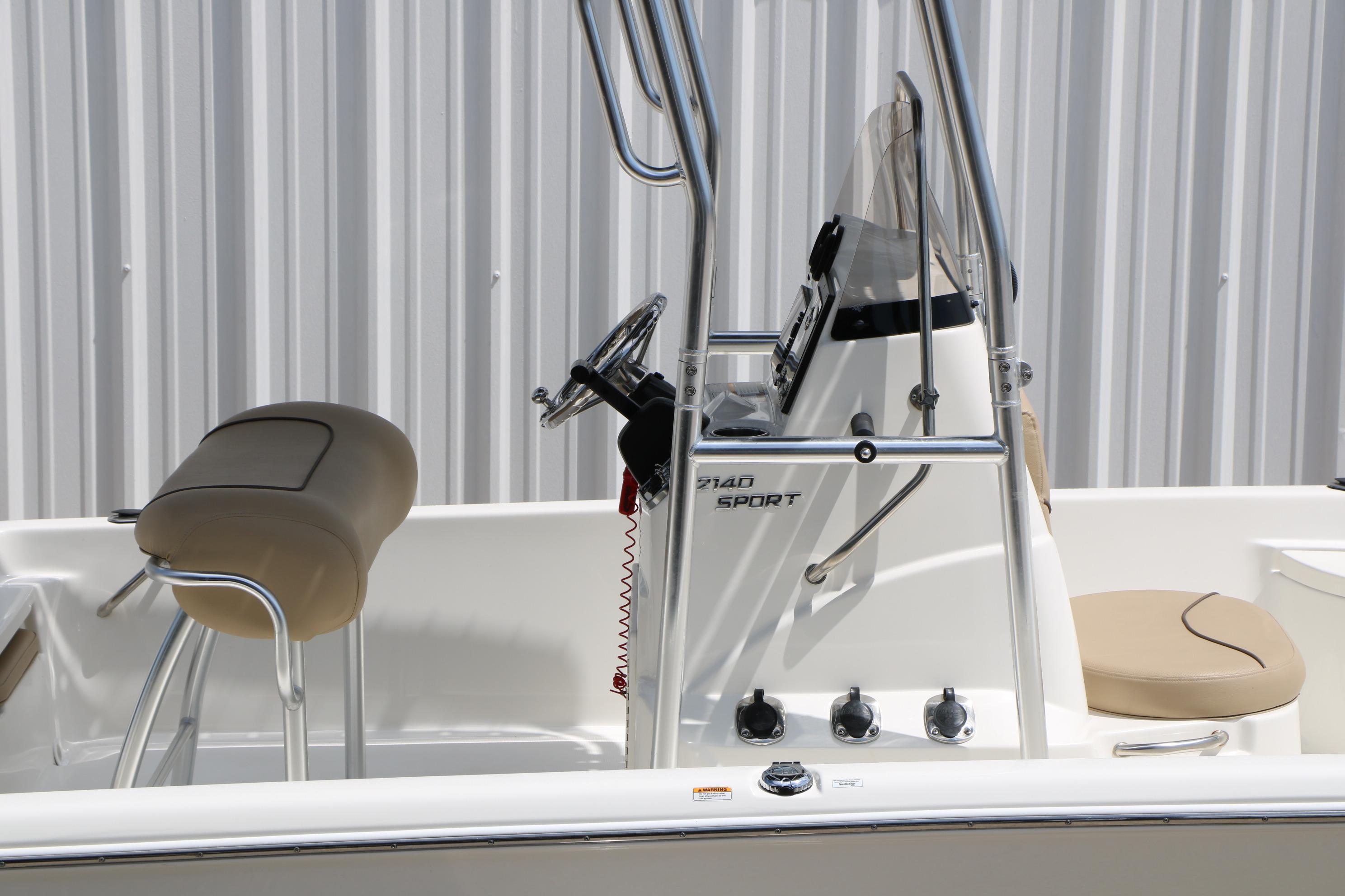 2020 NauticStar 2140 Sport boat interior with steering console and seating.