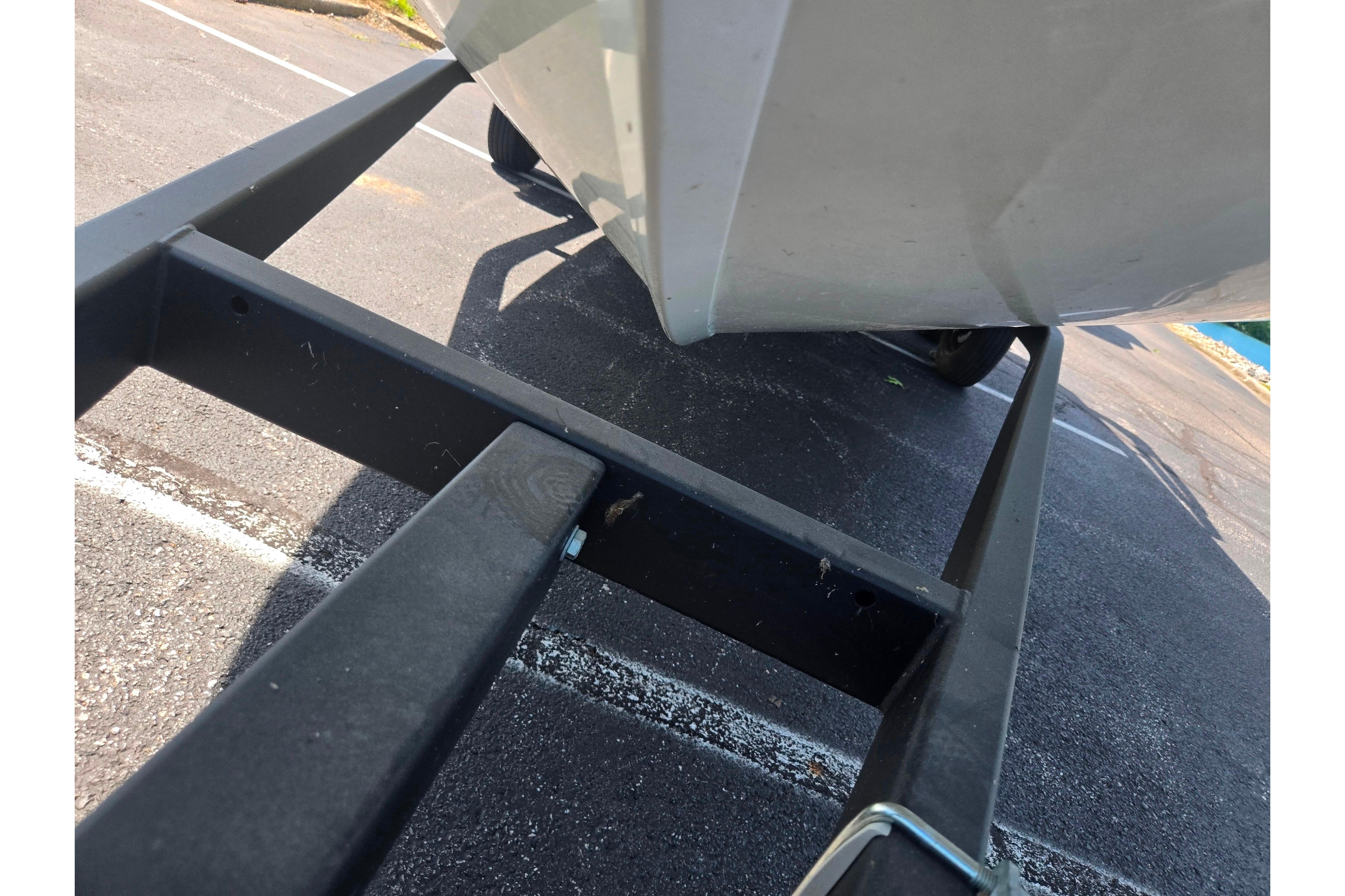 2015 Lowe Sport Deck 224 boat on trailer, parked on asphalt.