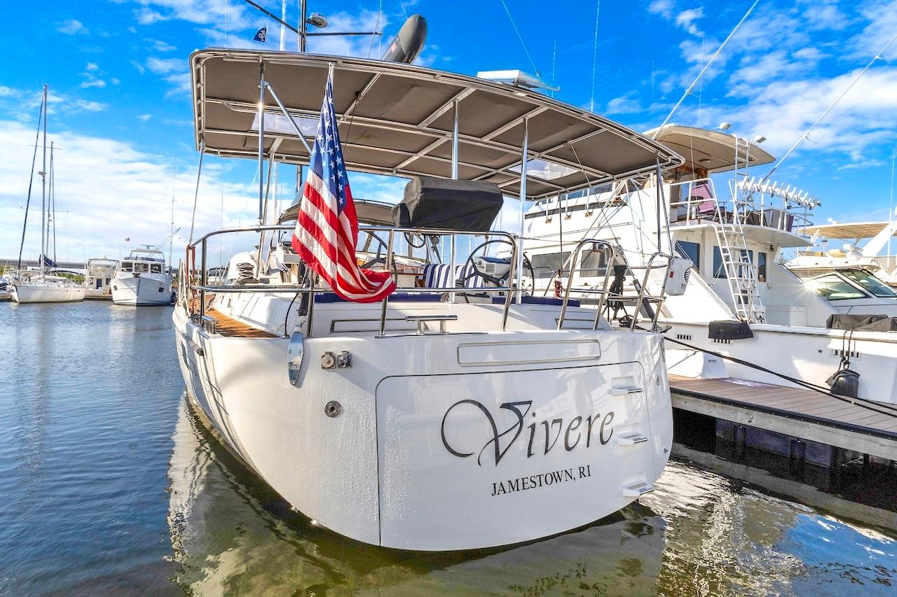 Sailing yacht "Vivere" docked, Southerly 57 RS, 2011 model, with American flag.