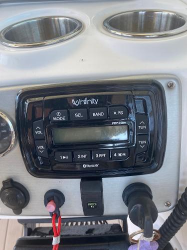 Infinity stereo system on 2015 Hurricane SunDeck 2400 OB boat dashboard.