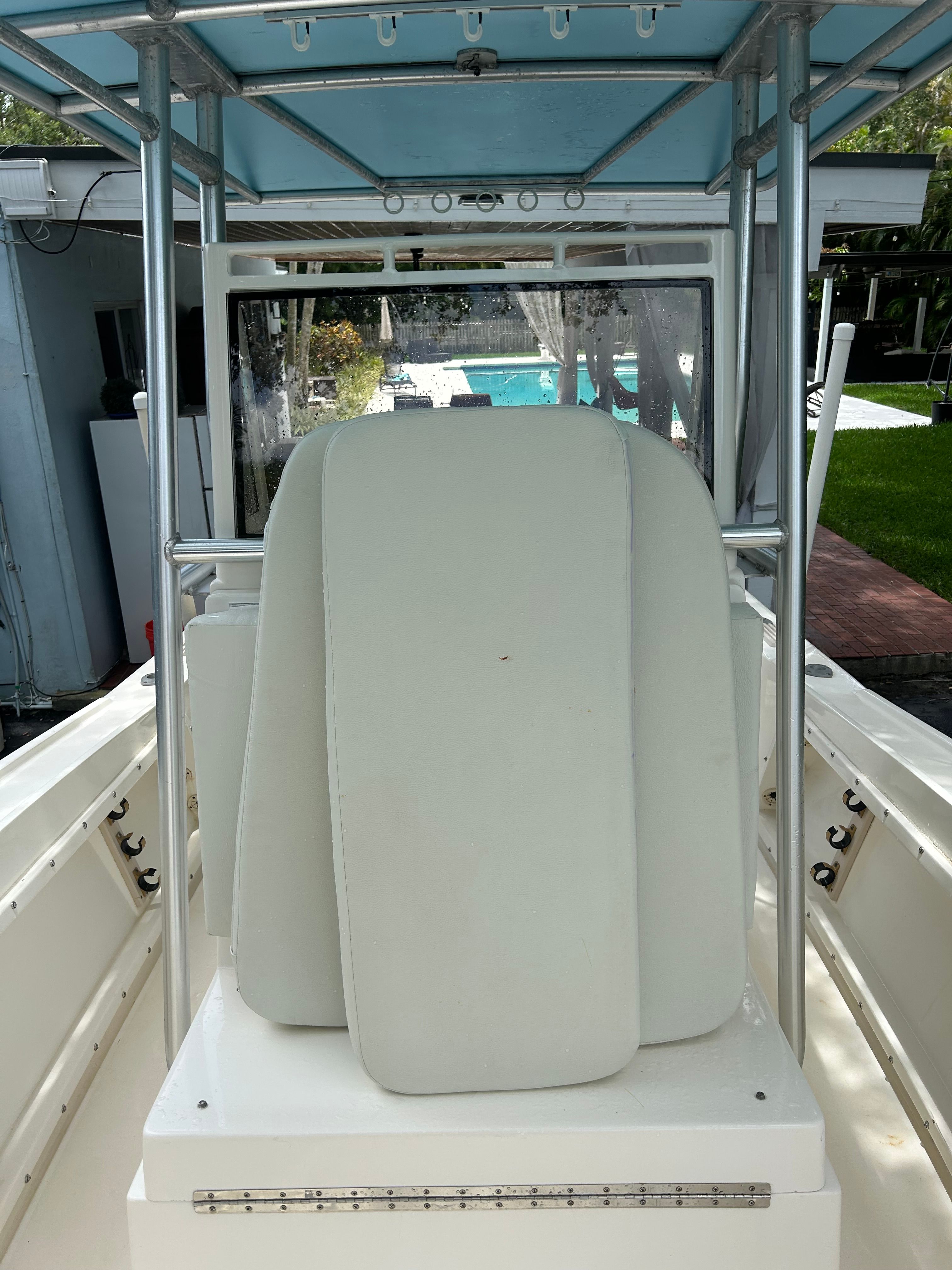 Interior view of a 1992 Mako 221 boat with white cushions.