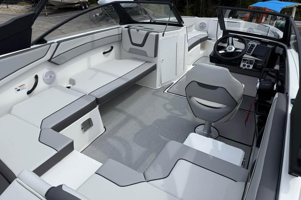 2026 Yamaha Boats AR220 interior with modern seating and sleek dashboard design.