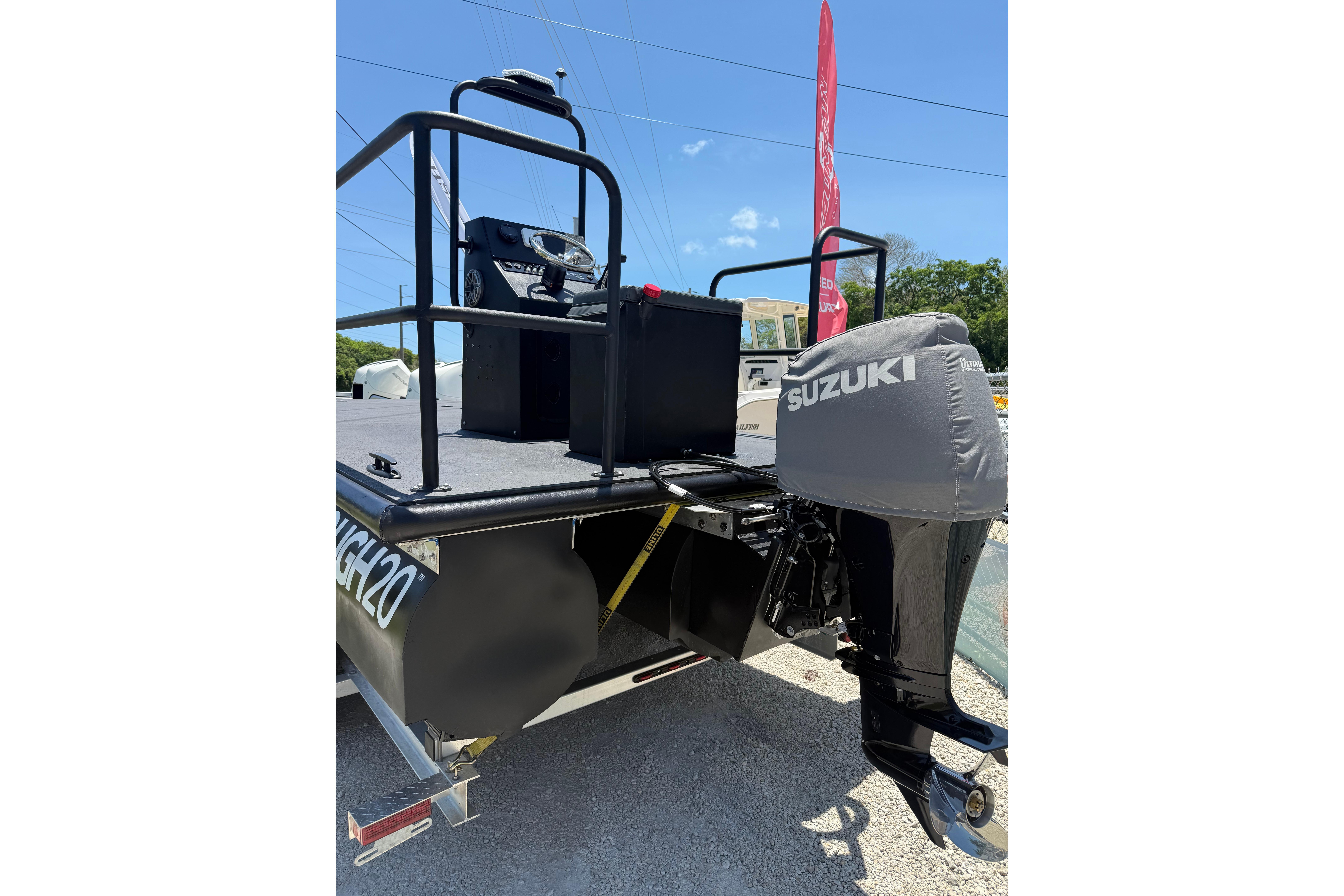 Tough 20 boat with Suzuki outboard motor, 2026 model, displayed outdoors.