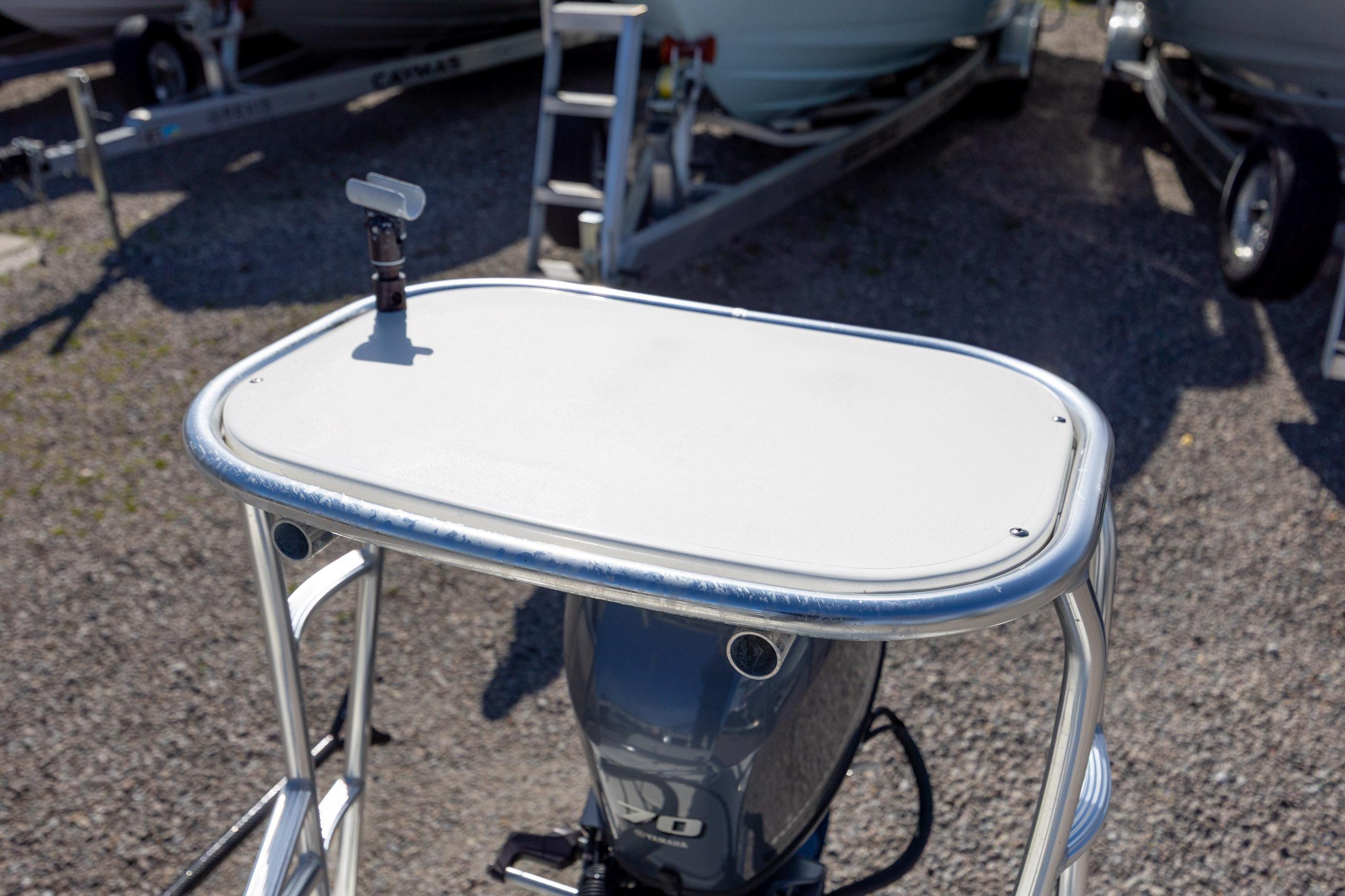 2024 Maverick 17 HPX-S boat with a sleek control panel and outboard motor.