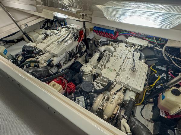 Engine compartment of a 2006 Tiara Yachts 3200 Open, showcasing dual engines and wiring.