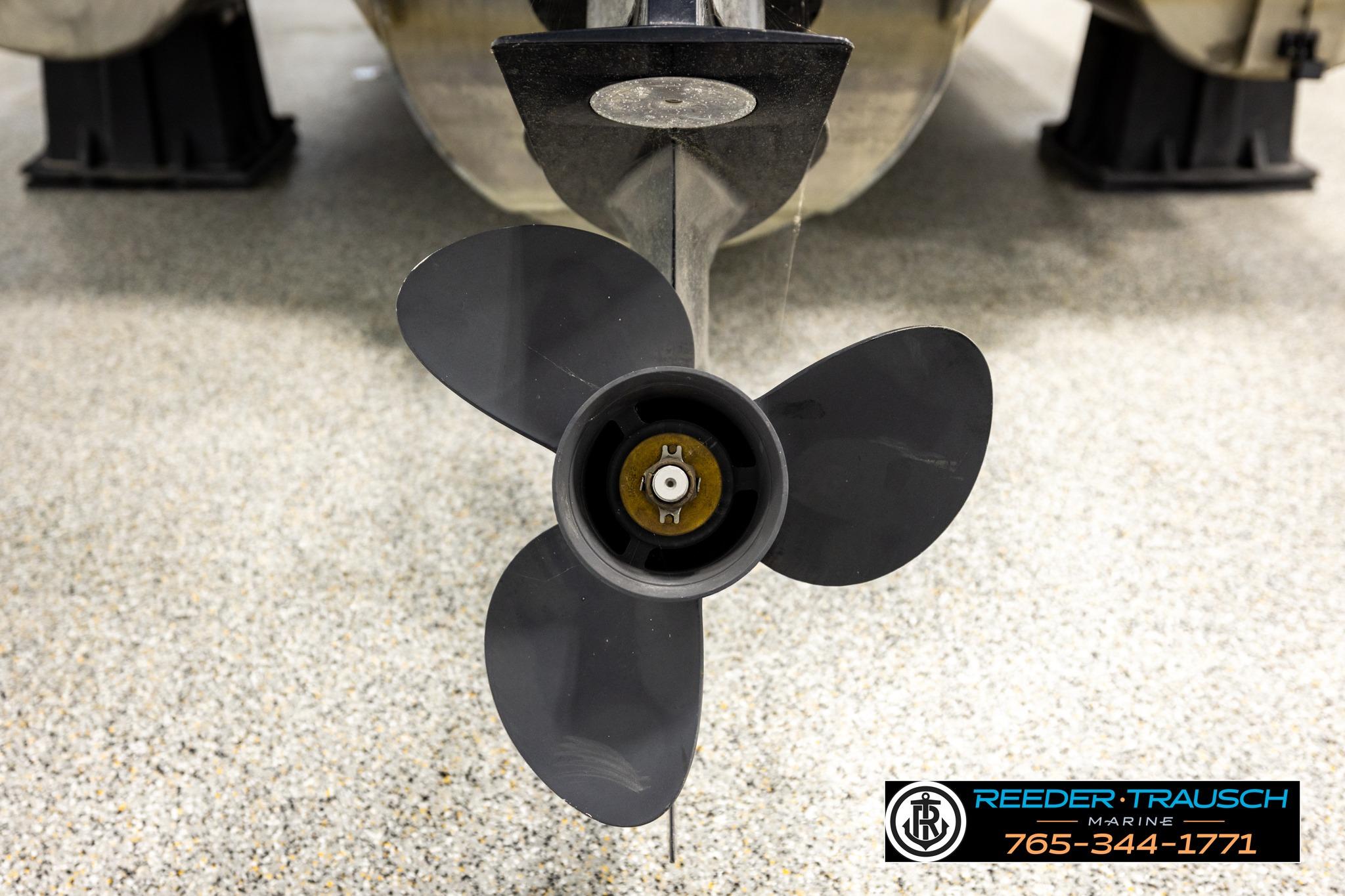 Close-up of a 2019 Manitou Oasis SR VP boat propeller on a showroom floor.