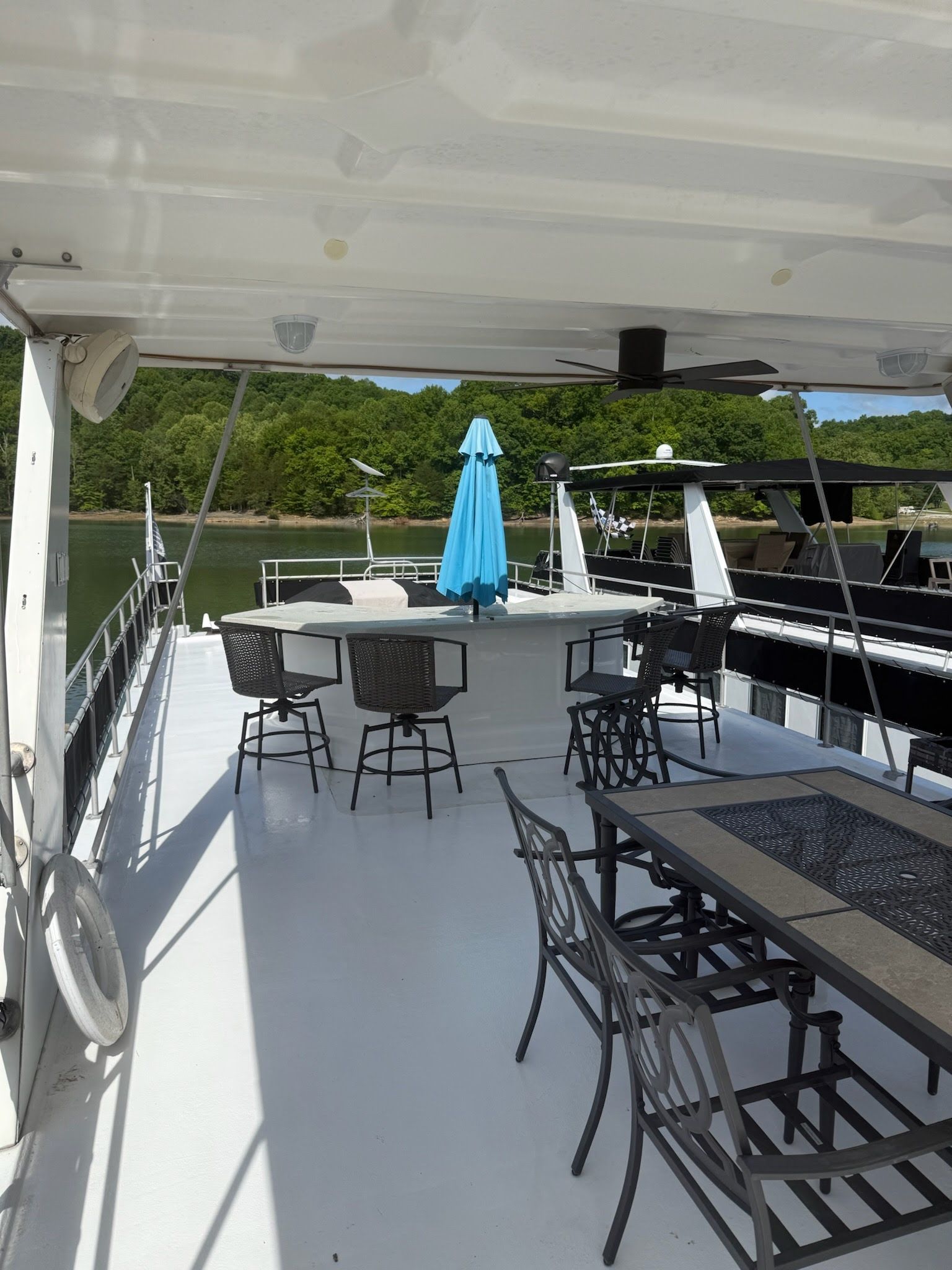 Deck of a 2003 Lakeview 16x70 houseboat with seating area.