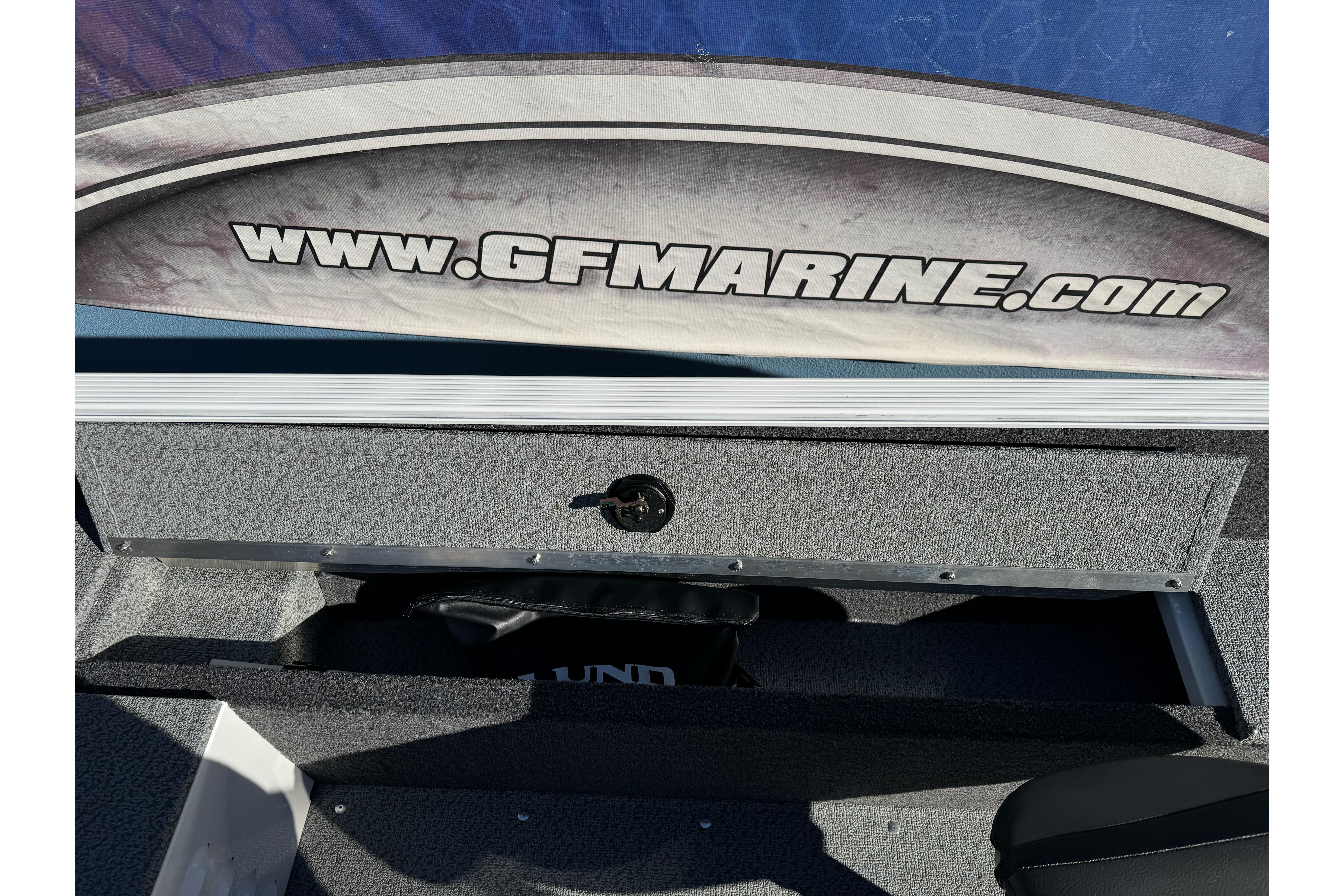 2026 Lund 1650 Angler SS boat interior with storage compartment and GFMarine.com branding.