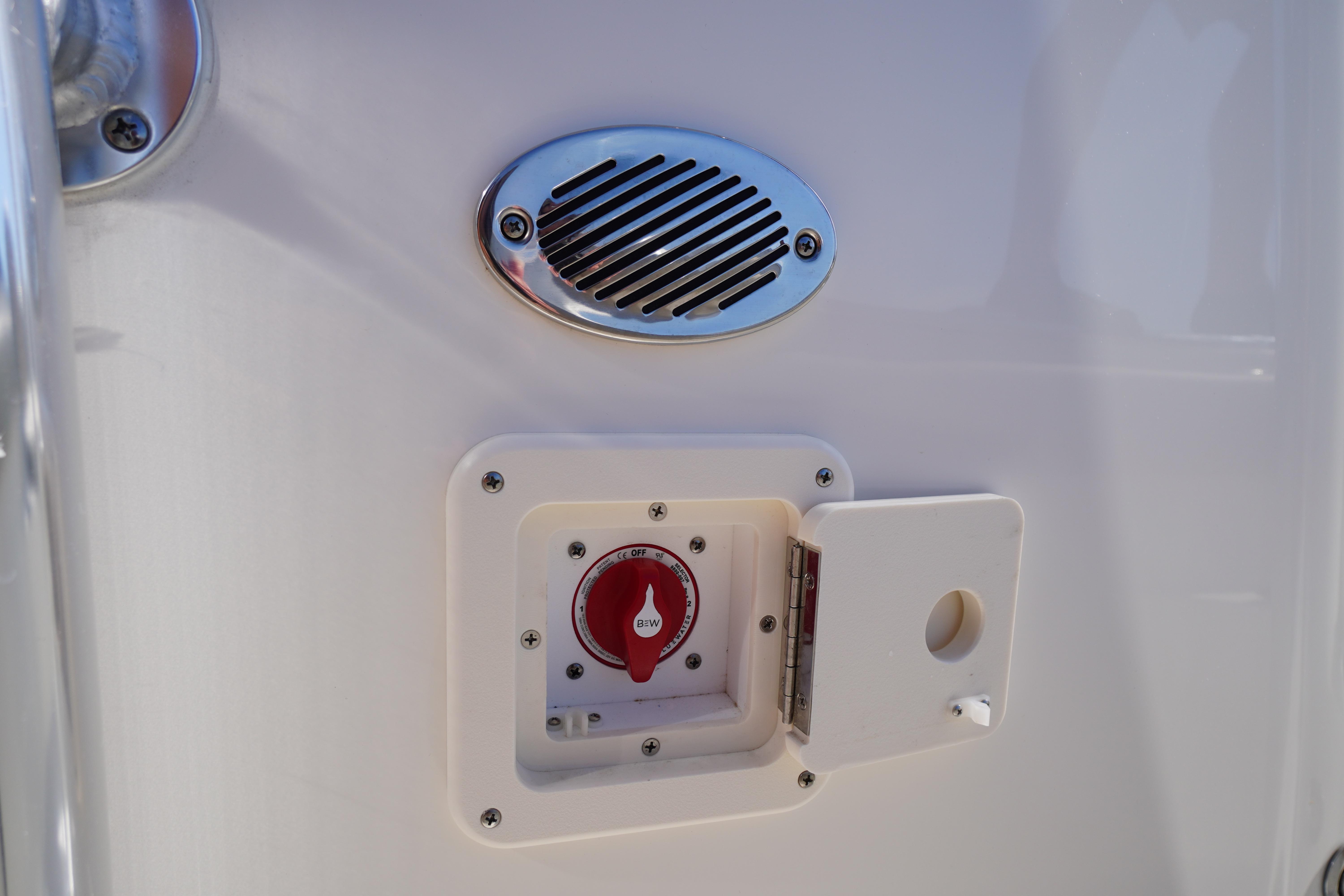 Key West 203 FS 2025 boat control panel with switch and vent.