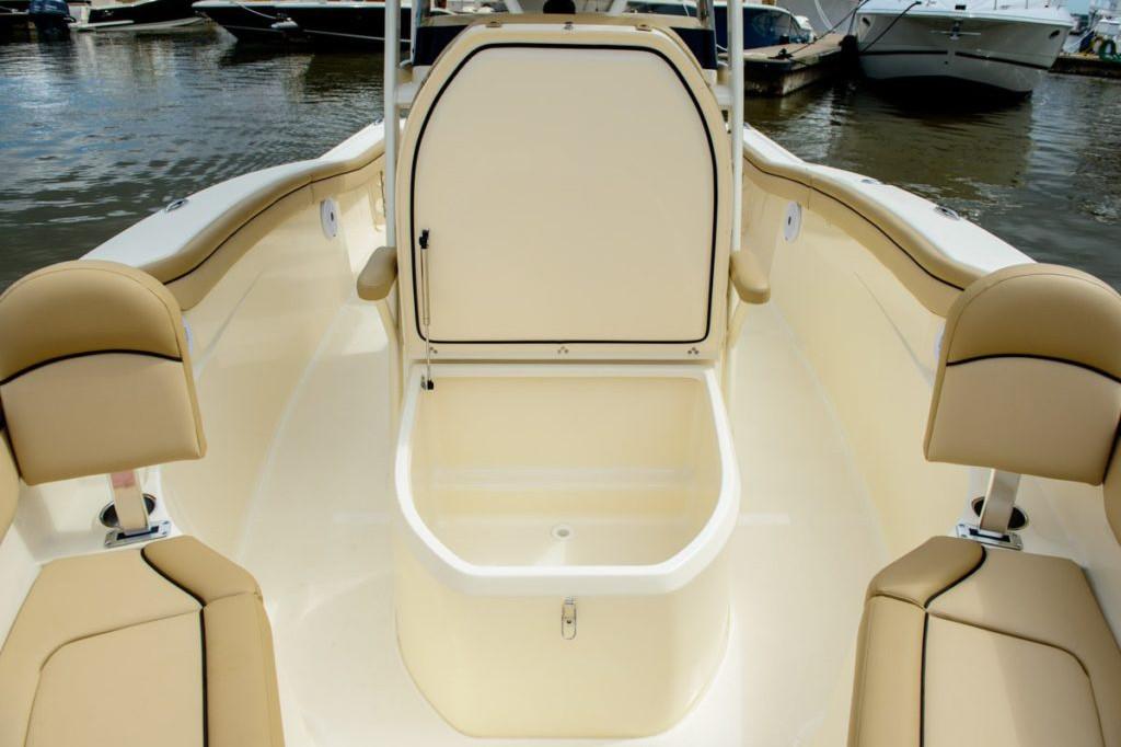 Manufacturer Provided Image: 2025 Scout 215 XSF boat interior with seating and storage compartment.