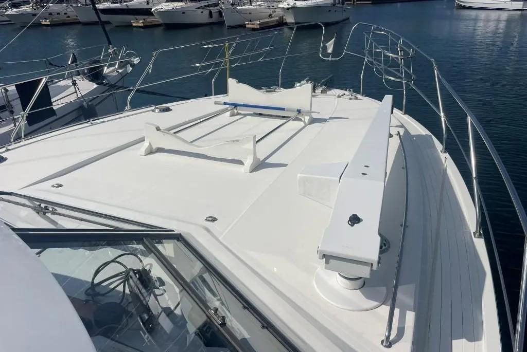 1985 Princess Sedan Flybridge yacht deck with marina view.