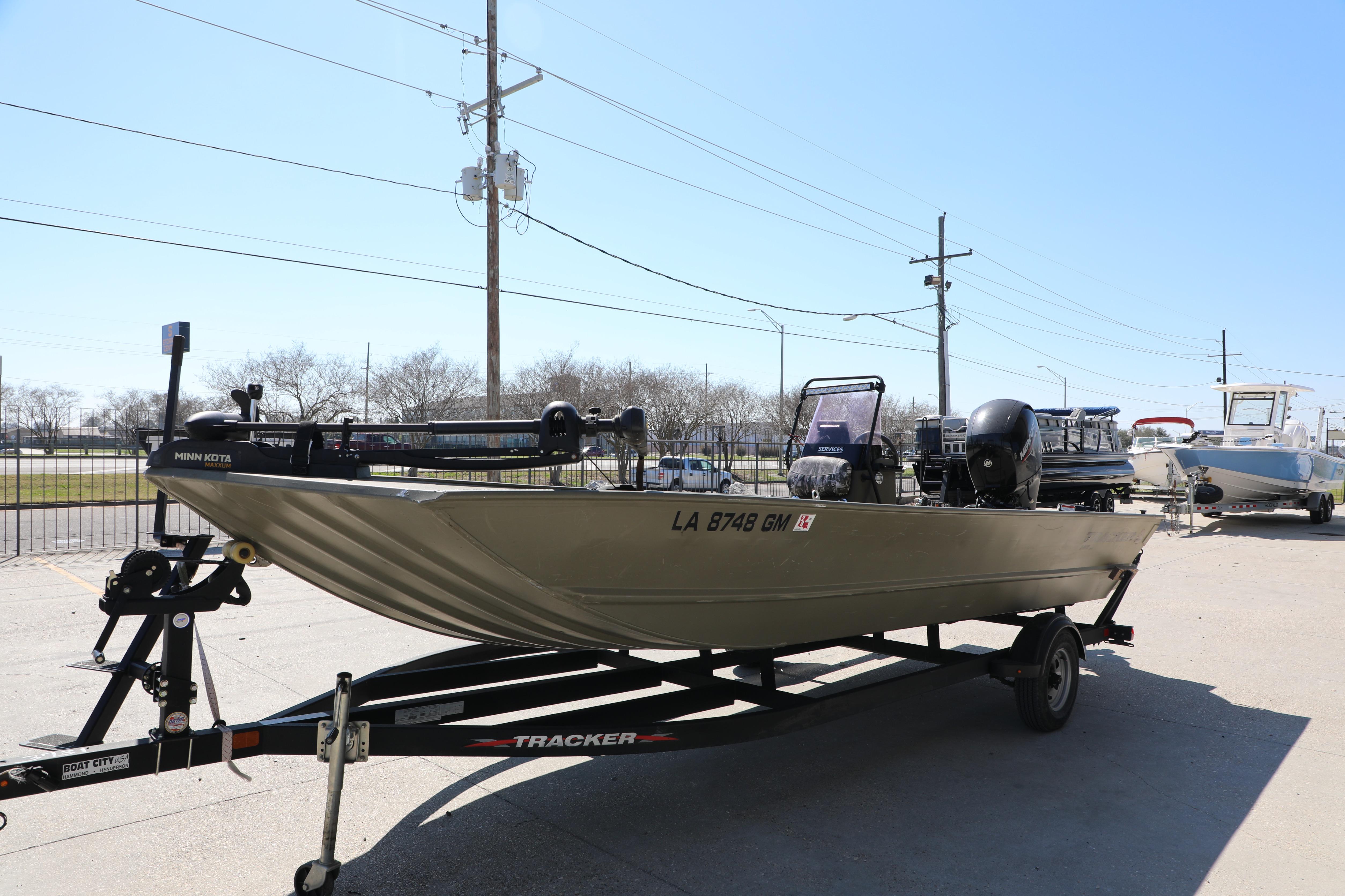 2021 Tracker Grizzly 2072 SC All-Welded boat on trailer, parked outdoors.