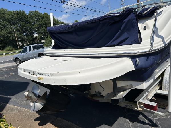 2005 Sea Ray 240 SD boat on trailer, rear view with propeller visible.