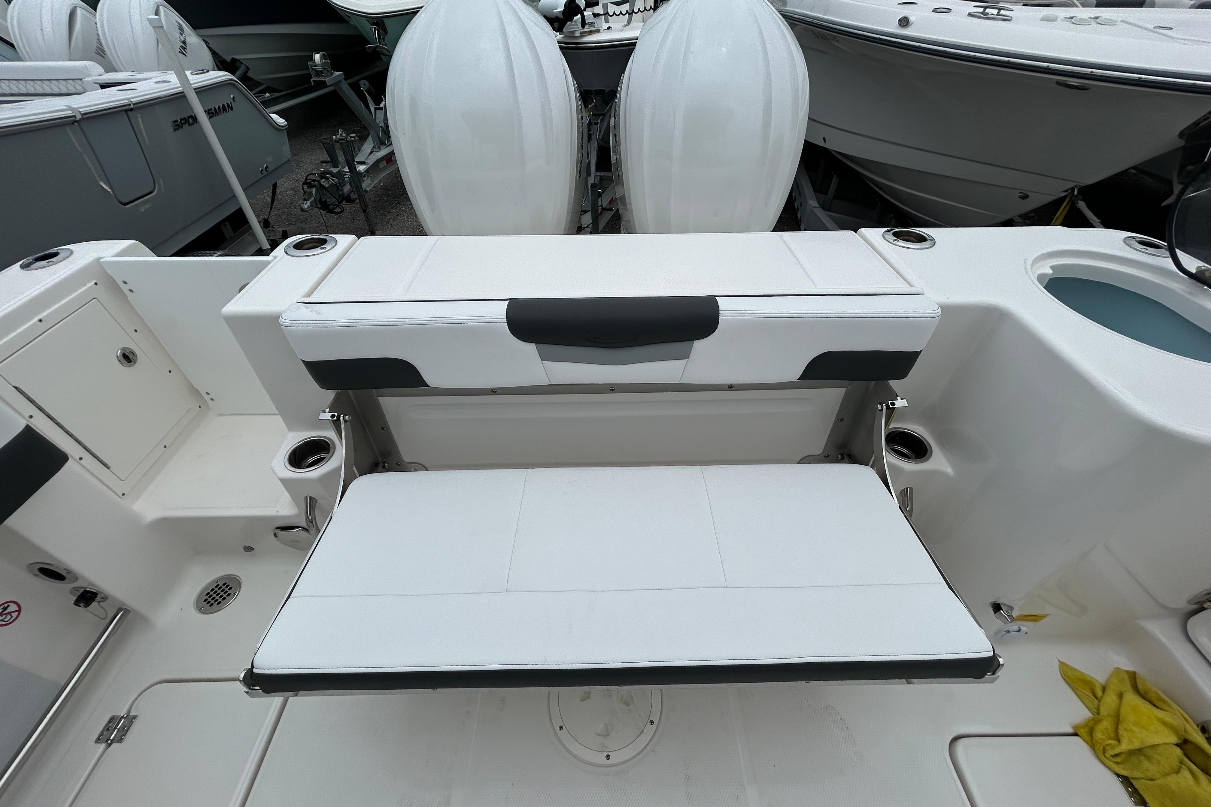2026 Robalo R277 Dual Console boat with foldable seating and twin engines.
