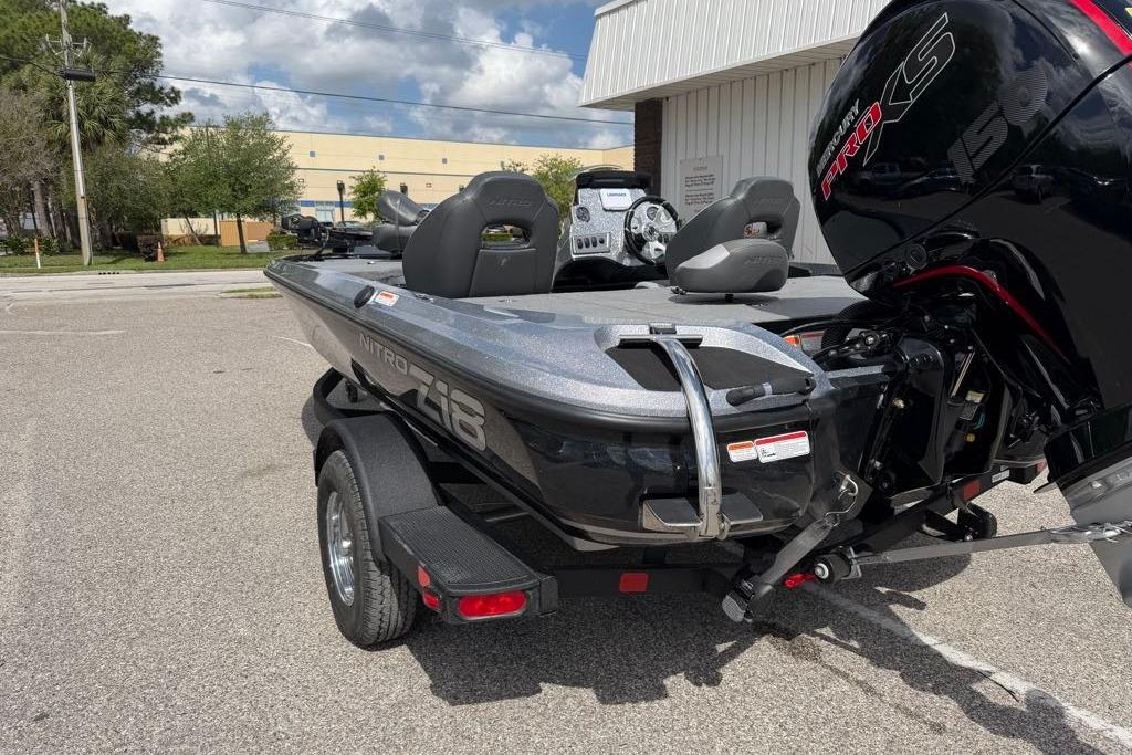 2026 Nitro Z18 boat with powerful engine, parked outdoors on a sunny day.