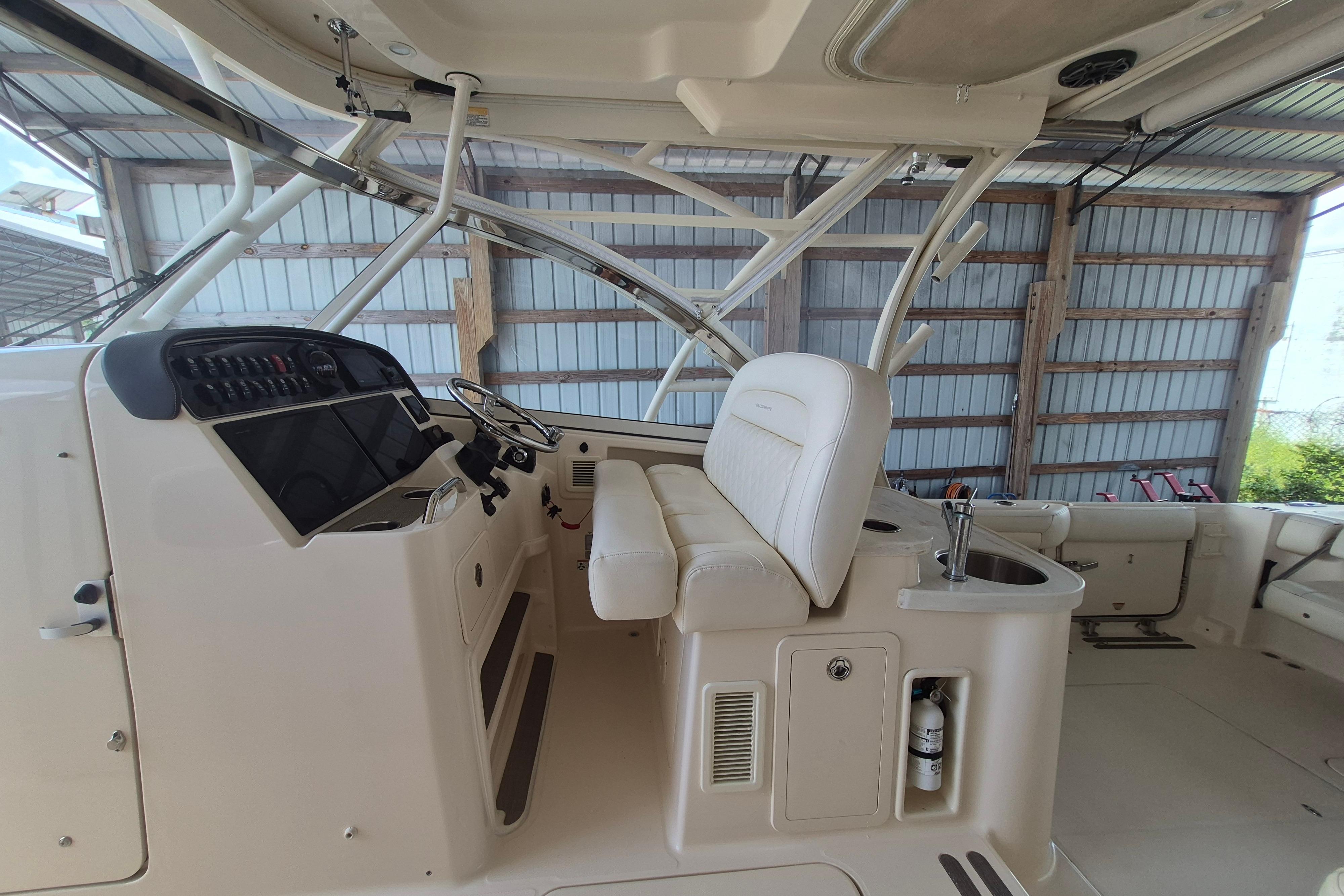 2019 Grady-White Freedom 335 boat interior with helm, seating, and storage features.