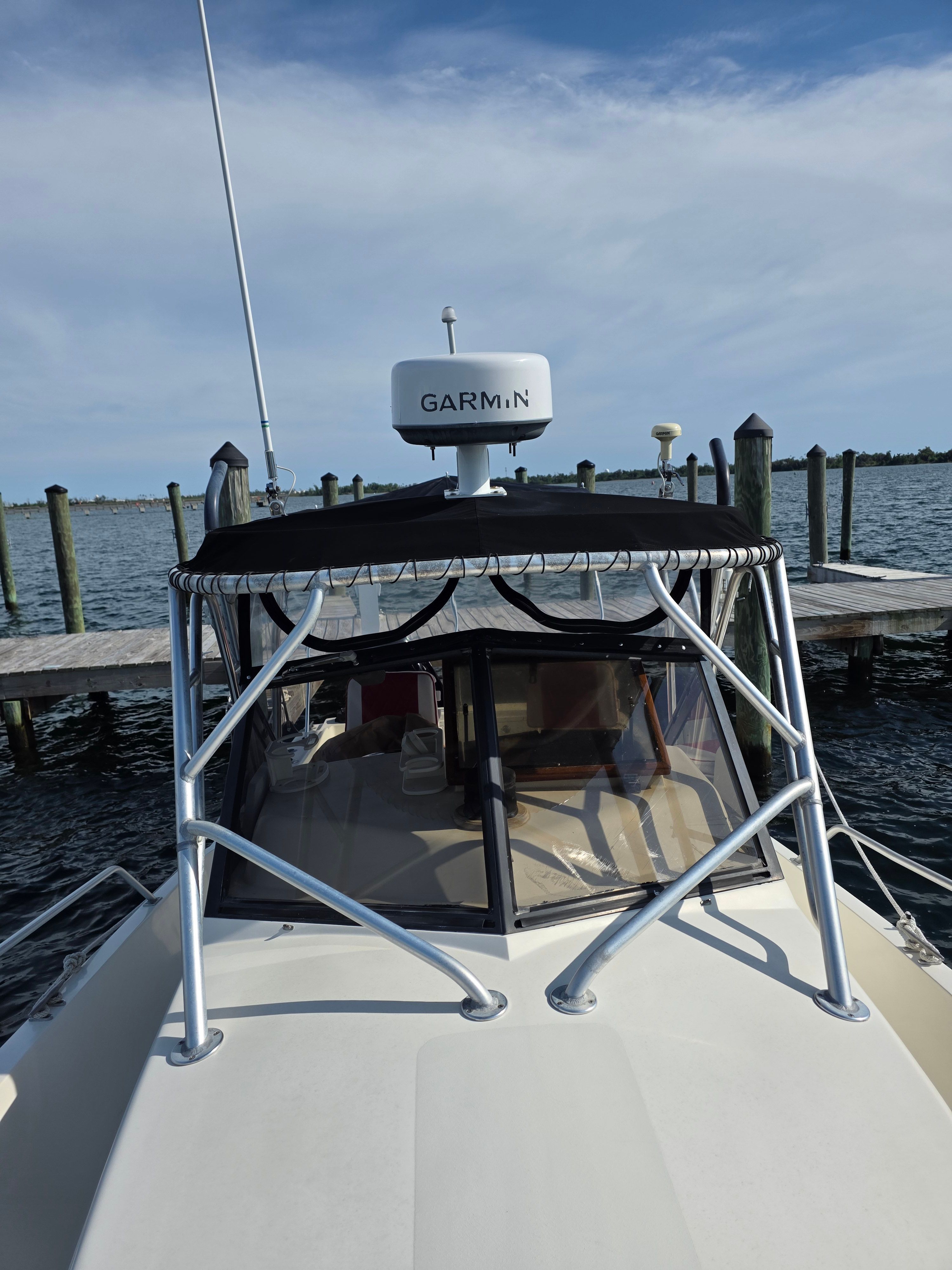 1987 Mako 248 WAC boat with Garmin equipment at dock.