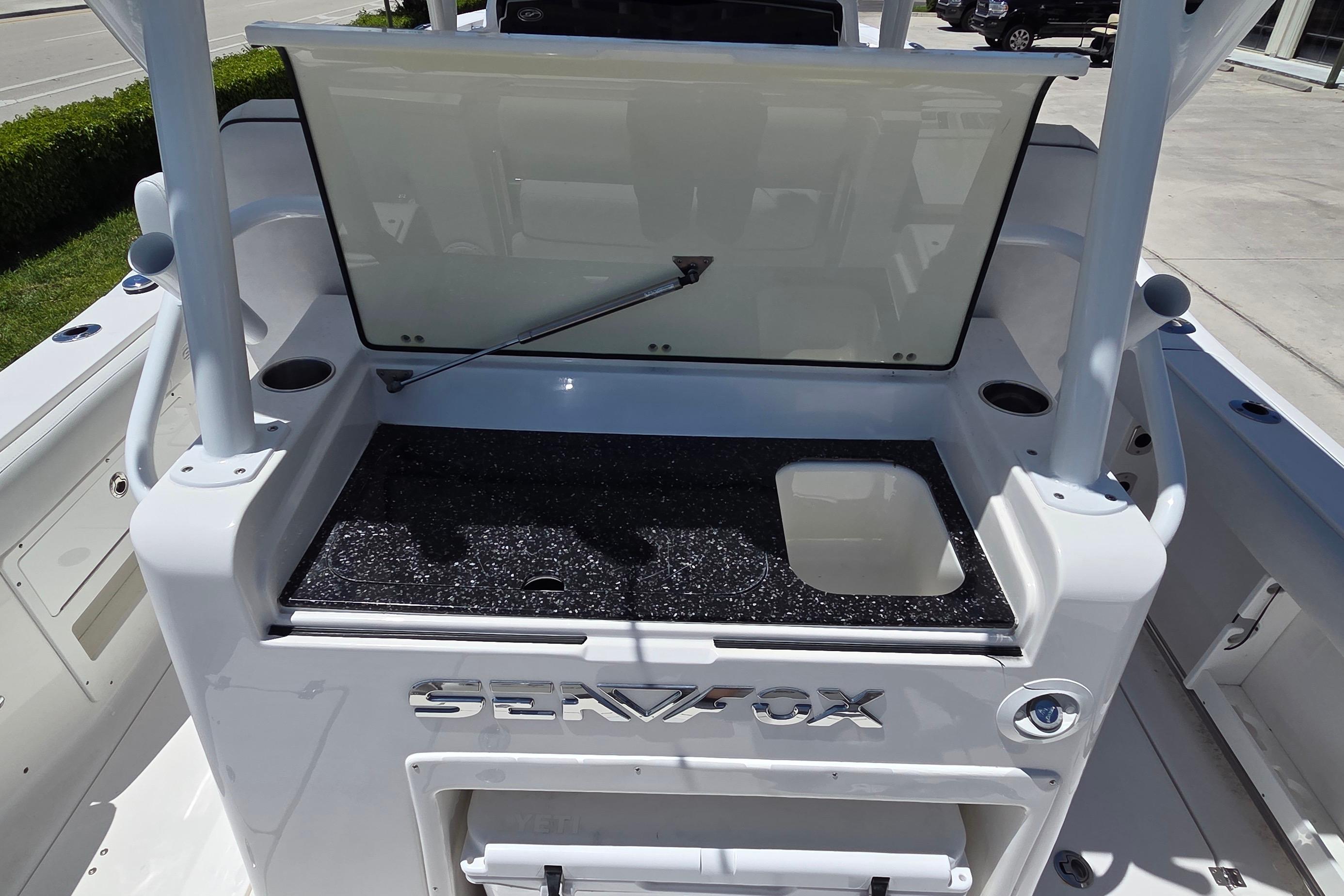 2021 Sea Fox 328 Commander boat interior with open storage compartment.