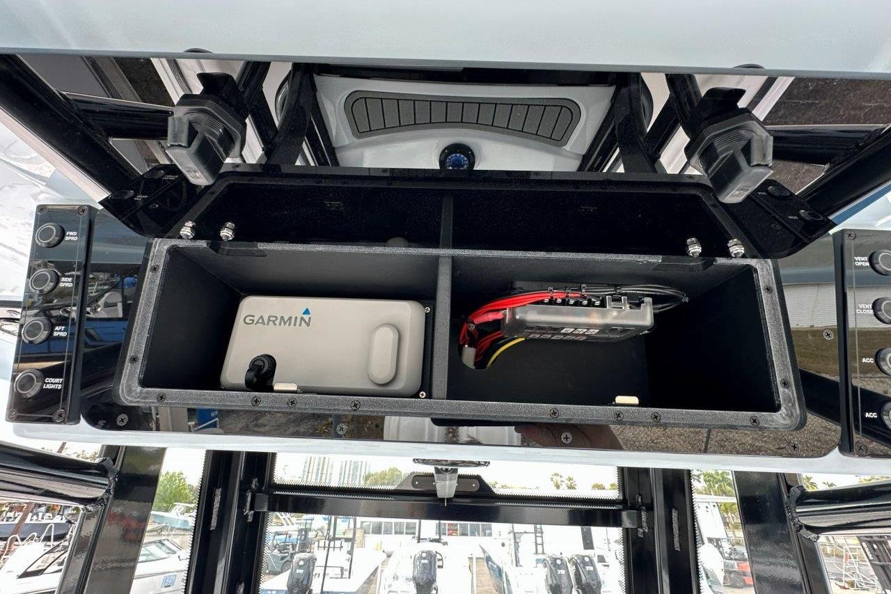 2026 Tidewater 272 LXF boat console with Garmin electronics and storage compartments.