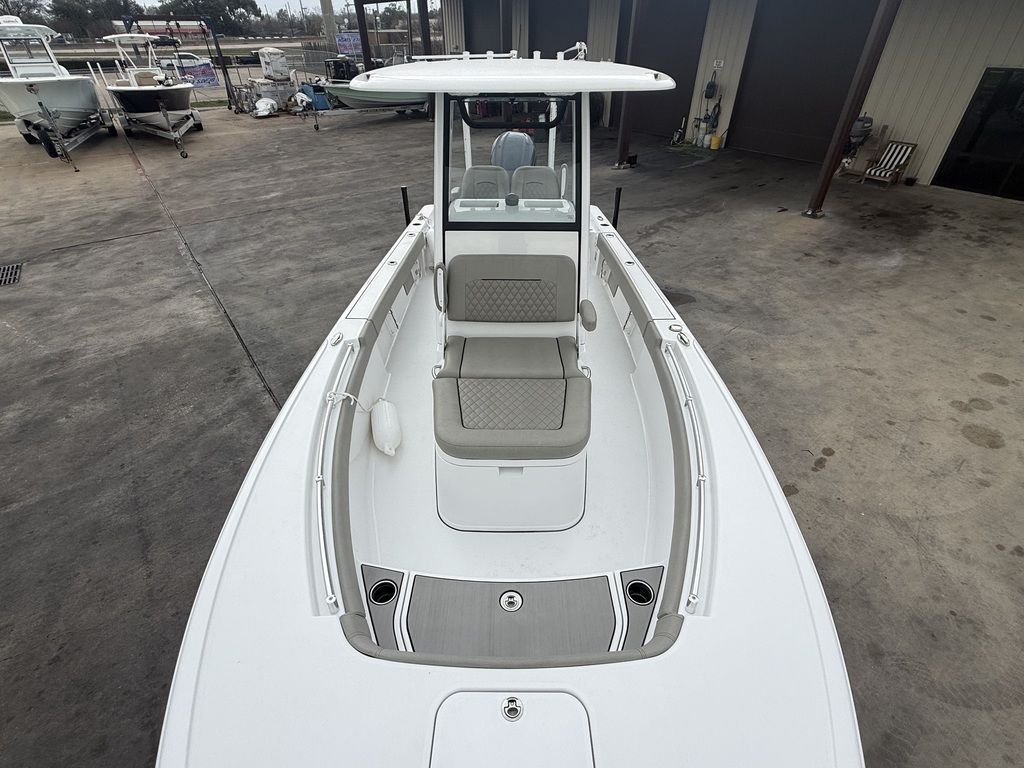 The image shows a 2025 Sportsman Masters 247OE Bay Boat. It is on a concrete surface.