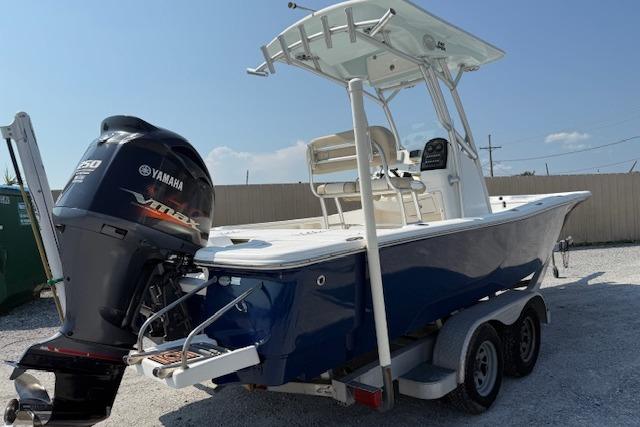 2016 Sea Fox 240 Viper boat with Yamaha engine on trailer, parked outdoors.
