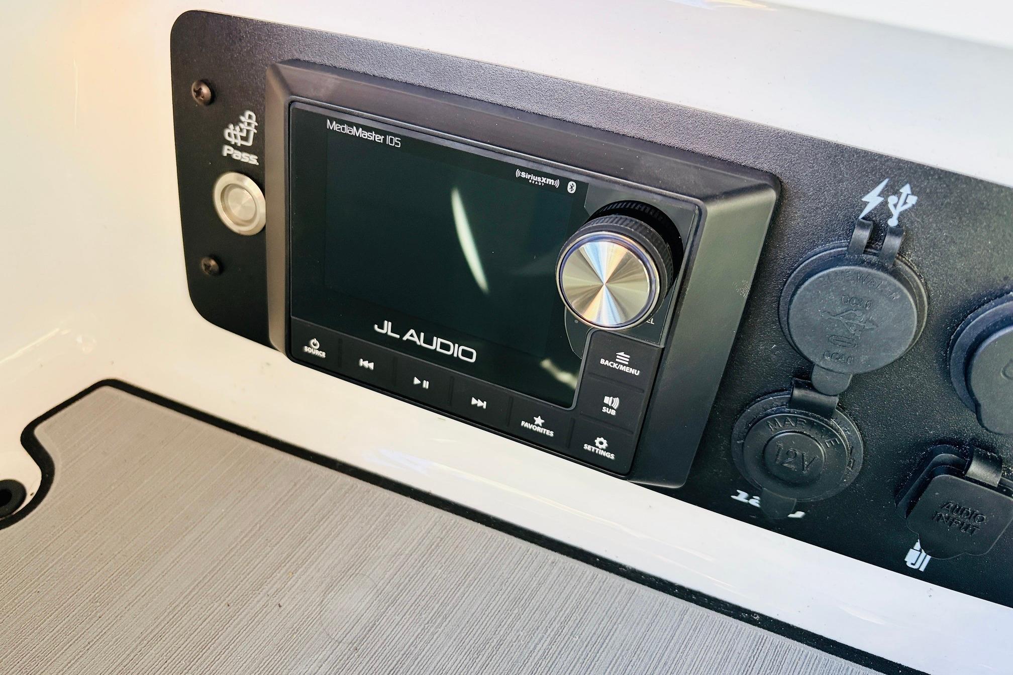 2023 Nautique Super Air Nautique G25 JL Audio system with control panel.