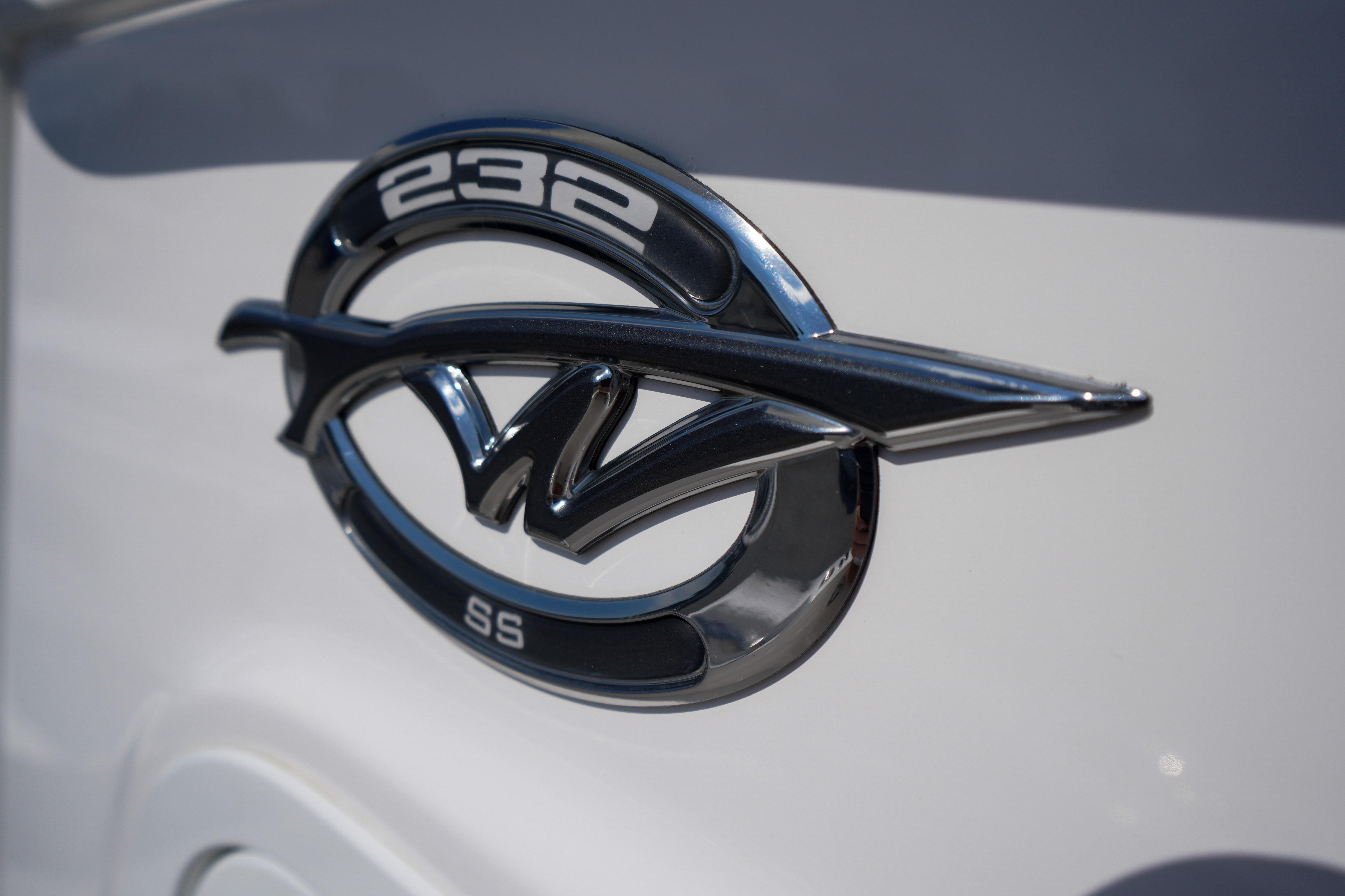 Close-up of 2025 Tidewater 232 SS emblem on white surface.