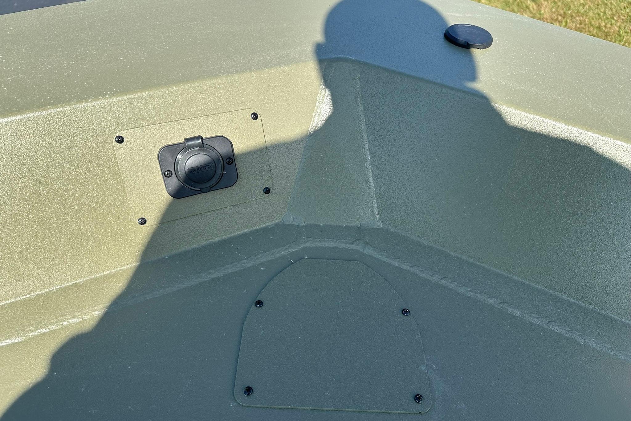 2026 Lowe Roughneck 1860SC boat interior with shadow and mounted accessory.