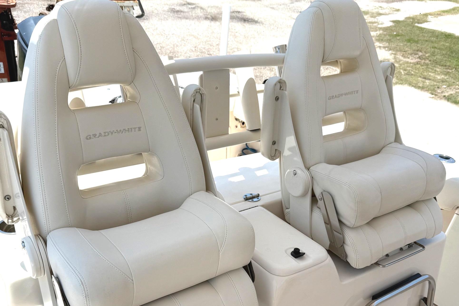2018 Grady-White Canyon 306 boat seats, featuring luxurious white leather upholstery.