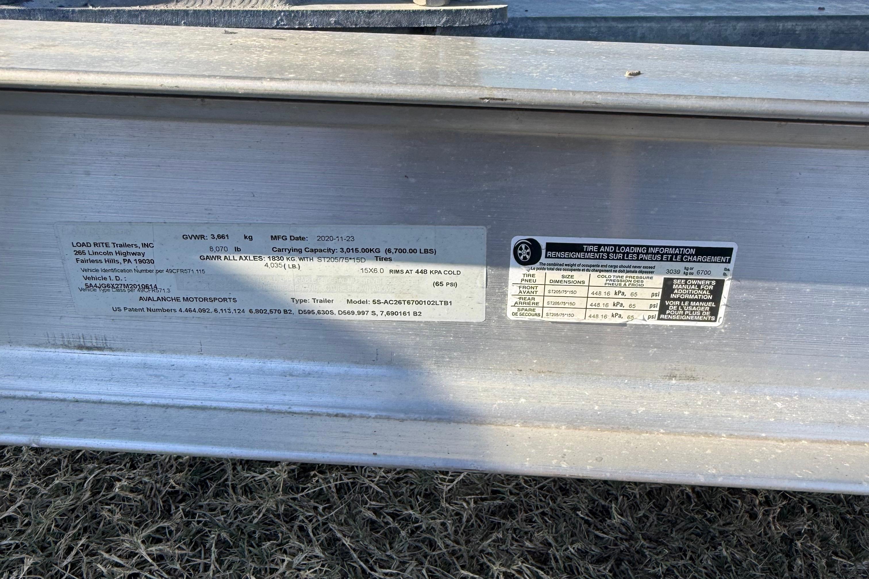 2021 Carolina Skiff 26 Ultra Elite trailer label with specifications and loading information.