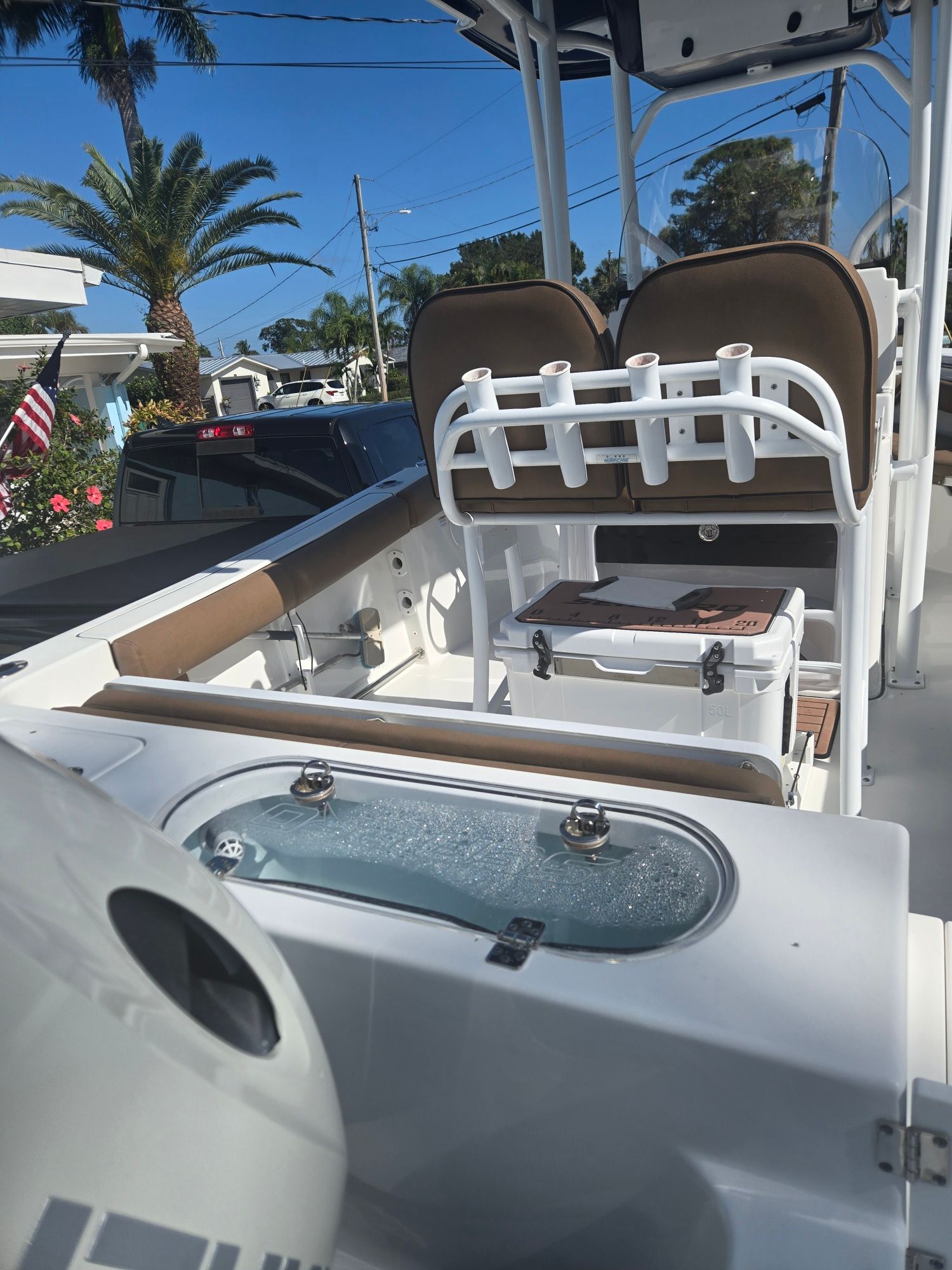 Interior view of a 2018 Sea Pro 21.9 boat with fishing rod holder.