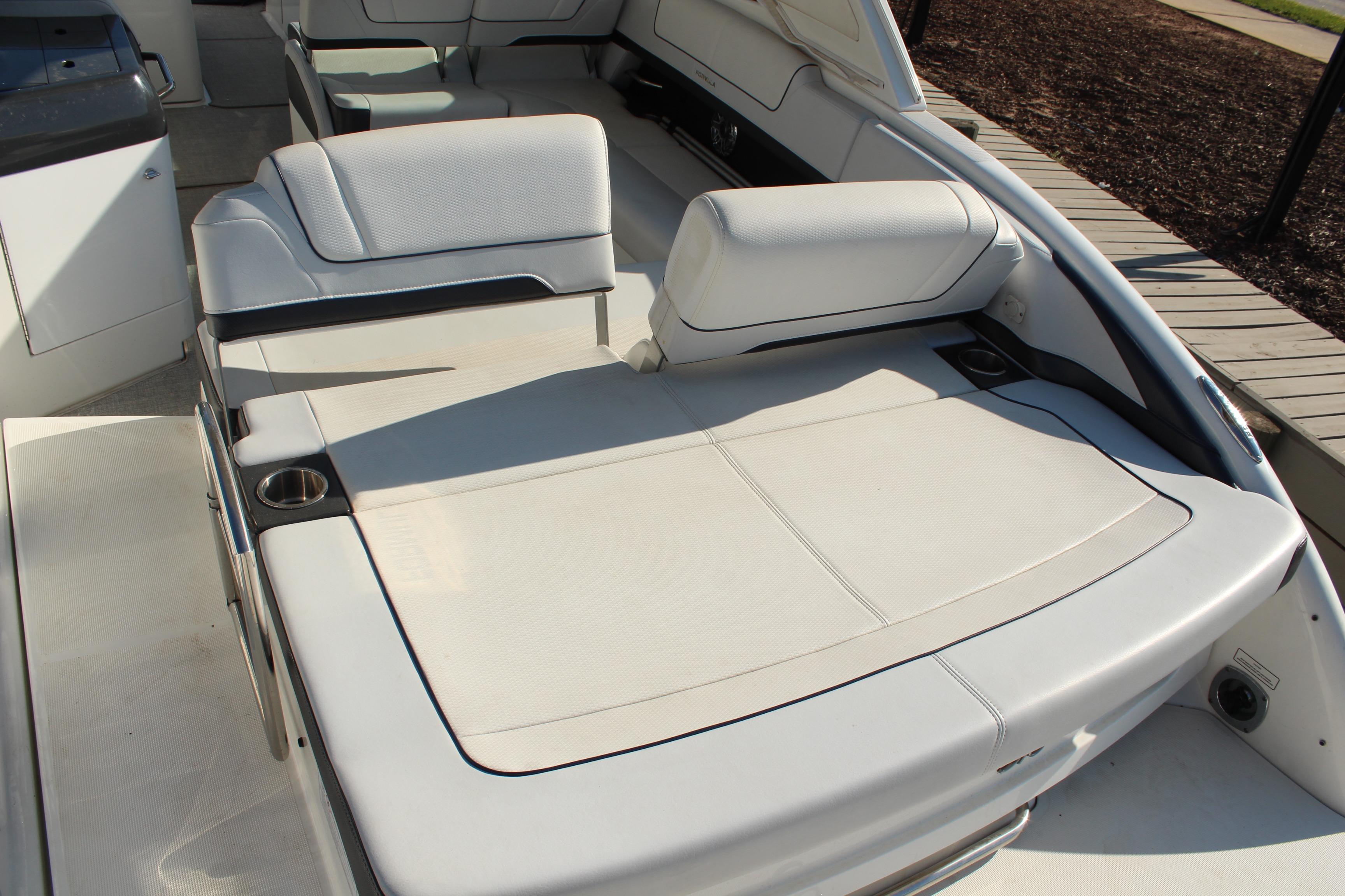 2023 Formula 310 Bowrider I/O interior with spacious seating and cup holders.