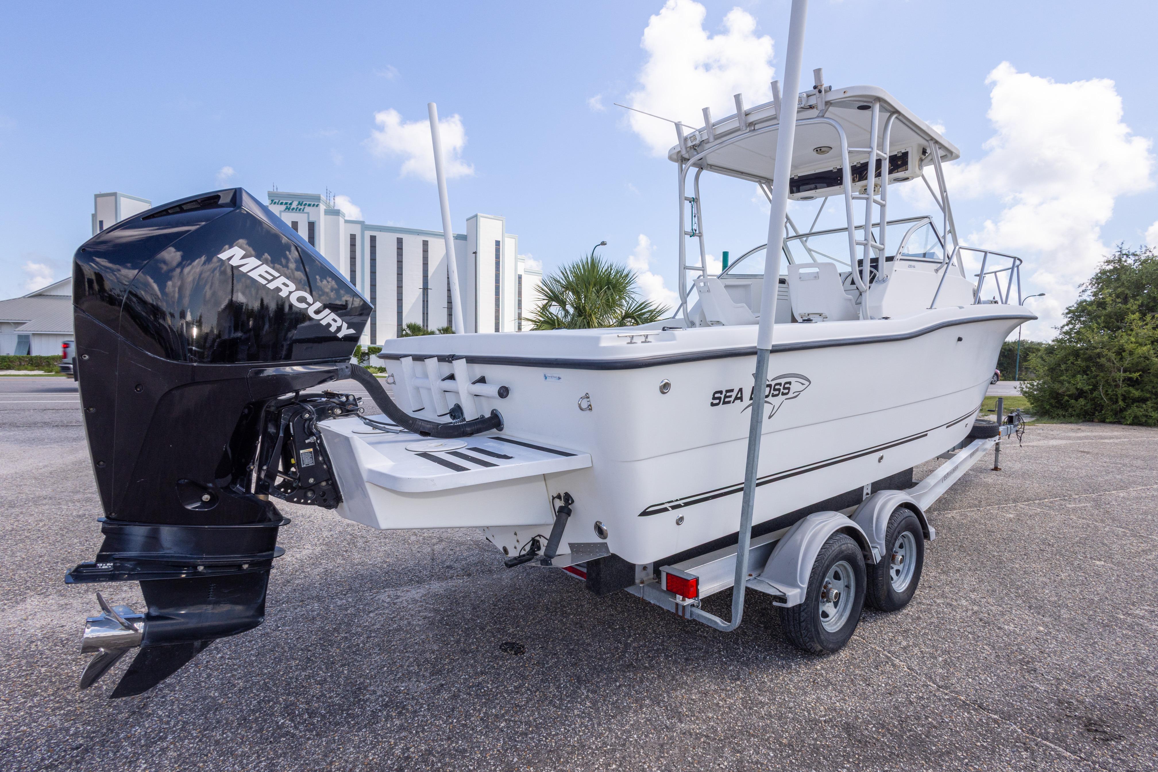 2007 Sea Boss 235 Walkaround boat on trailer with Mercury outboard motor.
