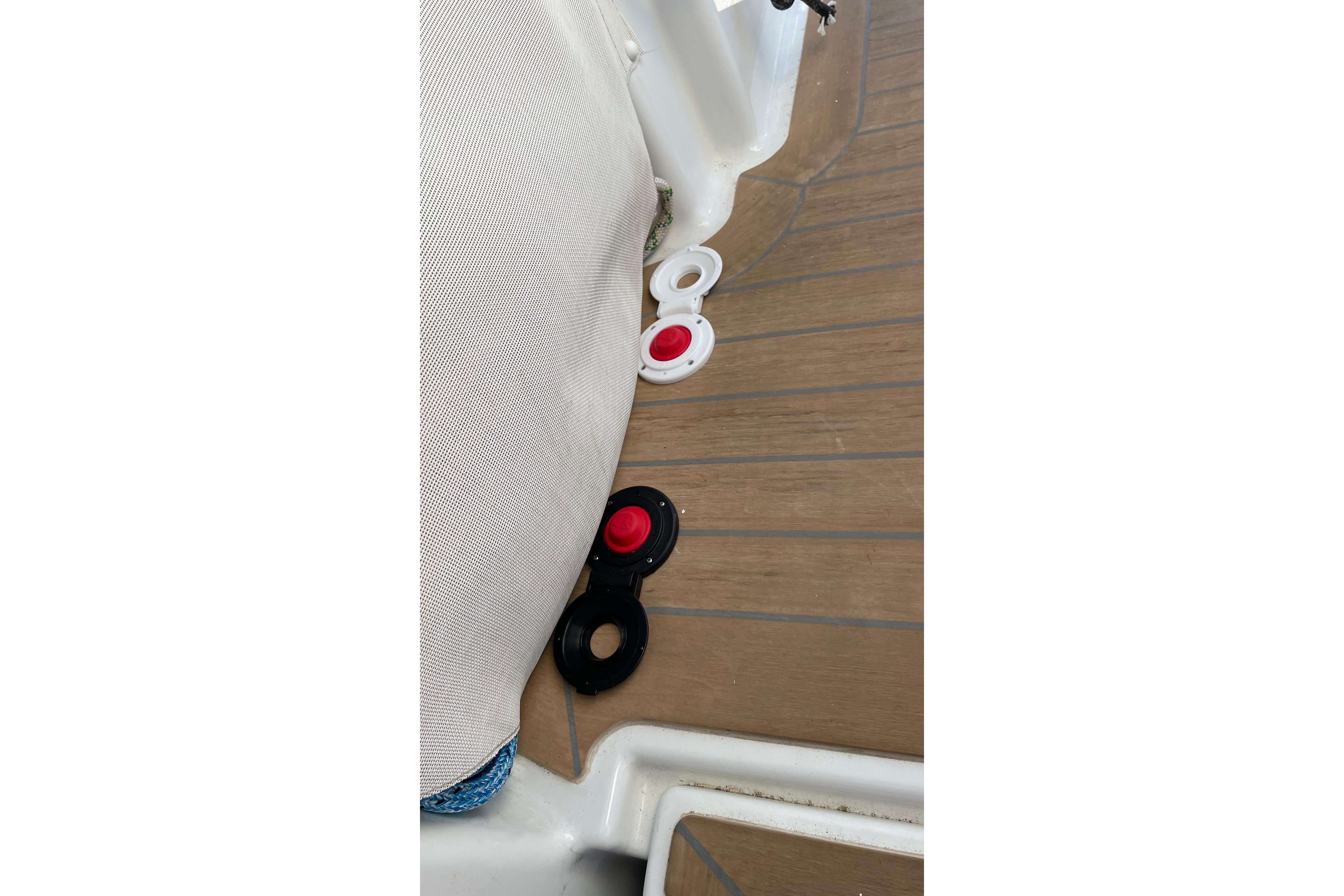 Deck fittings on 2020 Fountaine Pajot Saona 47 catamaran, featuring red and black components.