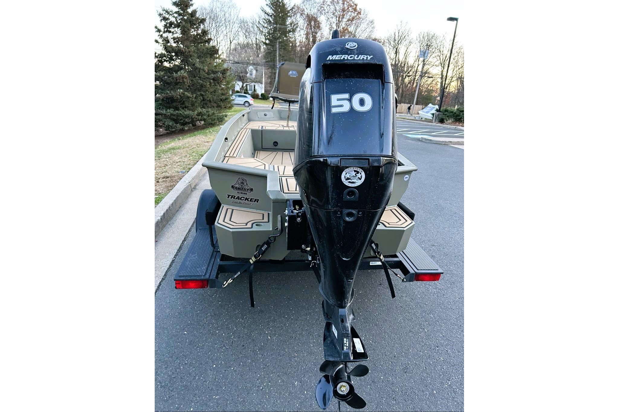 2026 Tracker Grizzly 1650 T Prairie Wings Edition boat with Mercury 50 outboard motor.