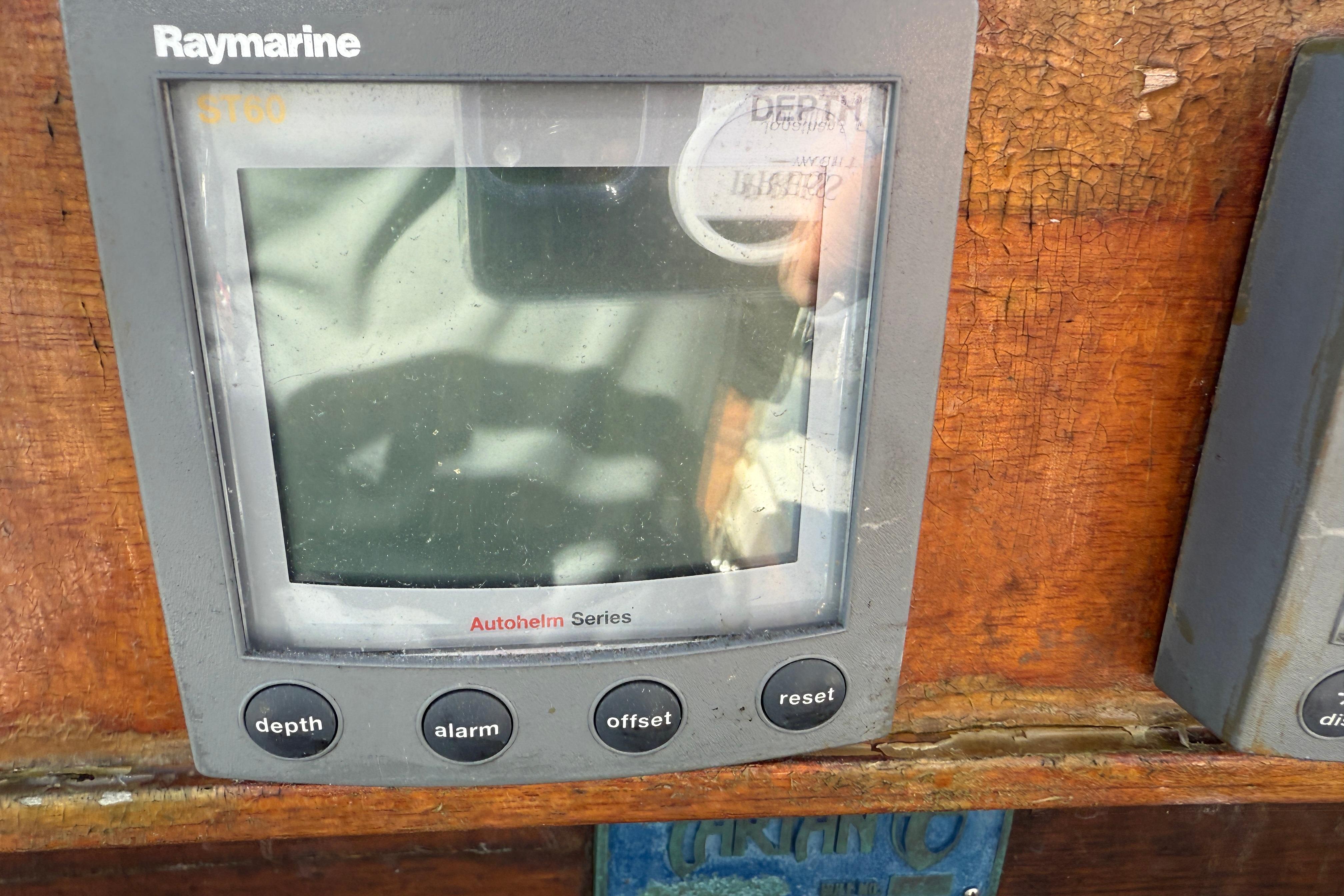 Raymarine ST60 display on 1997 Tartan 3800 sailboat, featuring depth, alarm, offset, and reset buttons.