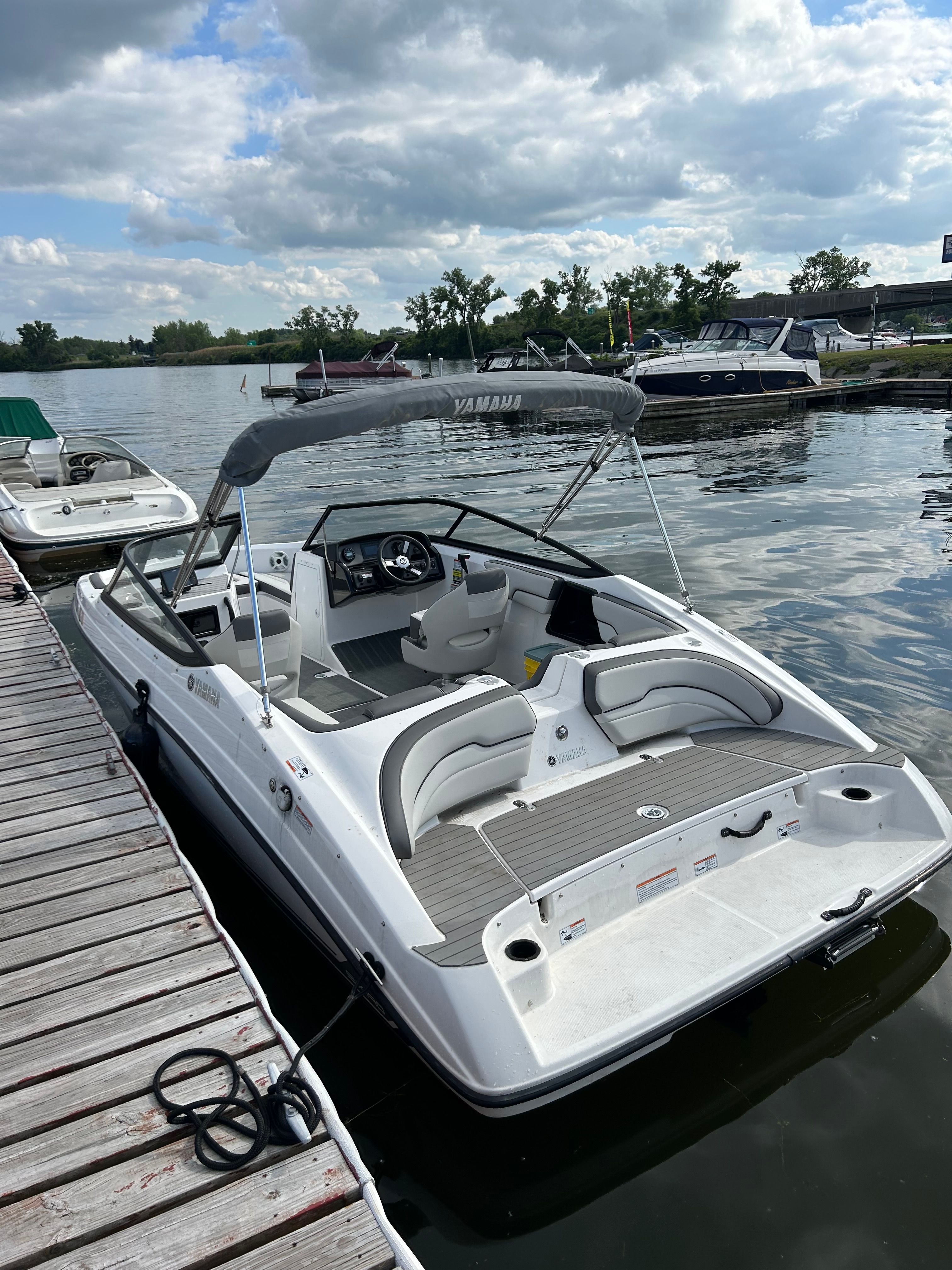 2020 Yamaha SX190 boat docked under cloudy skies.