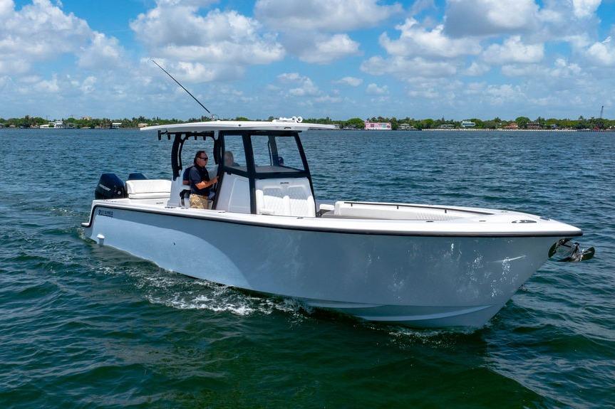 2027 Reef Runner 340 boat cruising on a sunny day with clear skies.