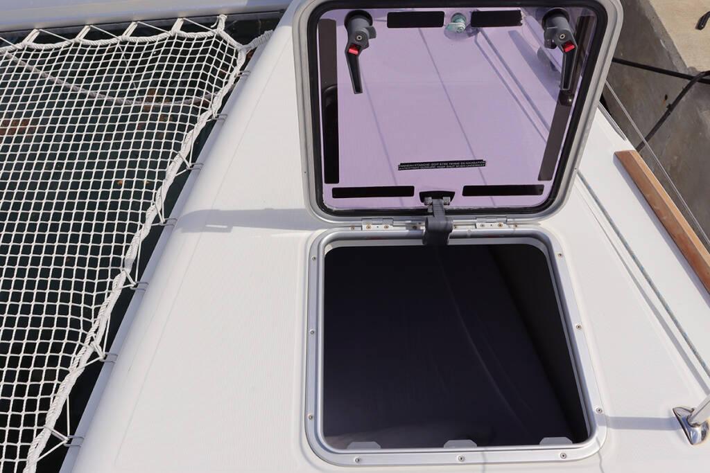 Open hatch on 2019 Lagoon 450 F catamaran deck with netting.