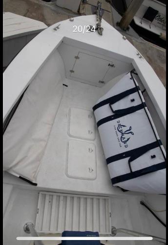 1979 Chaparral 224 Fisherman boat interior with storage and cooler bag.
