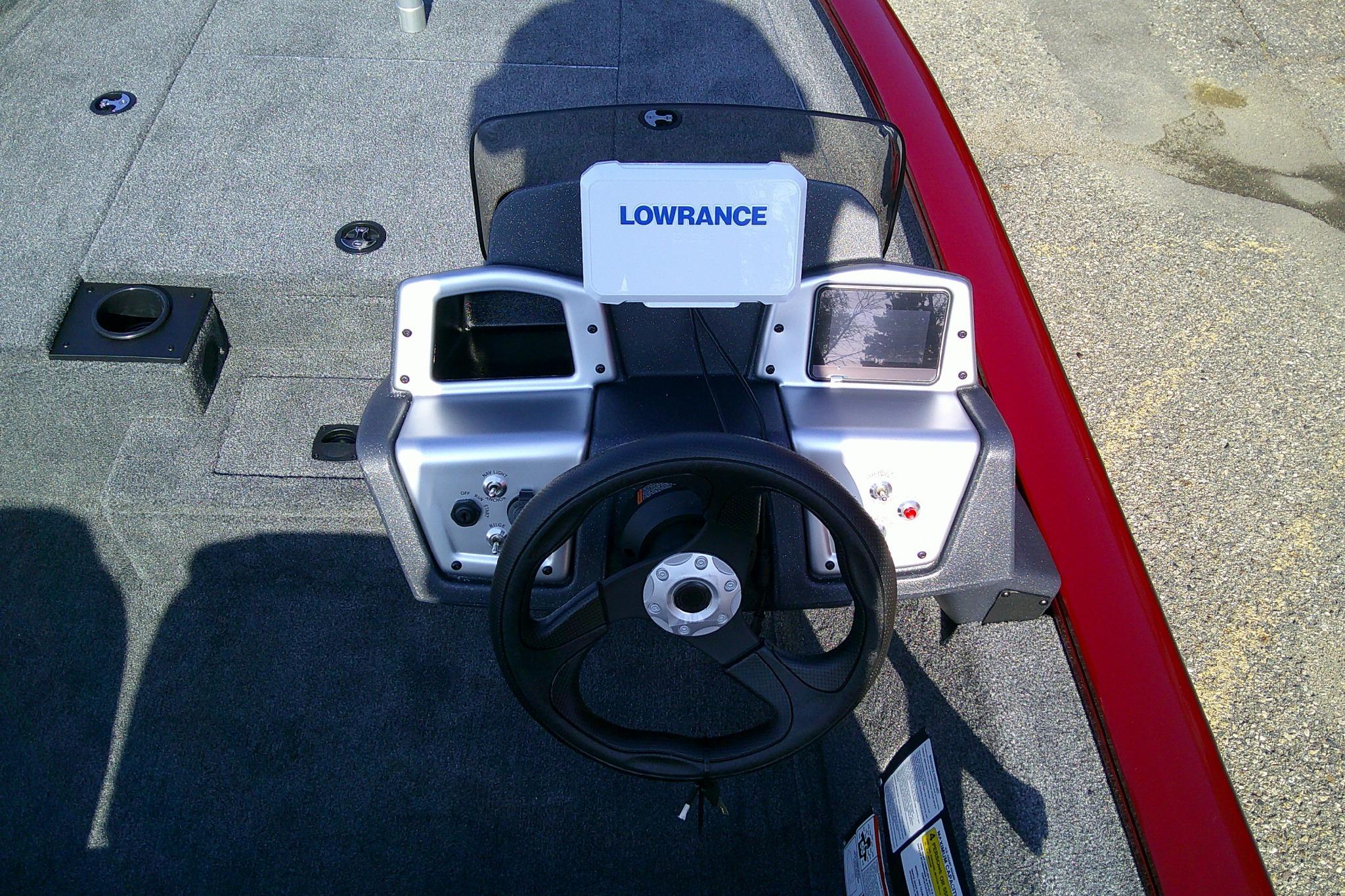 2025 Tracker Pro Team 175 boat dashboard with Lowrance electronics and steering wheel.